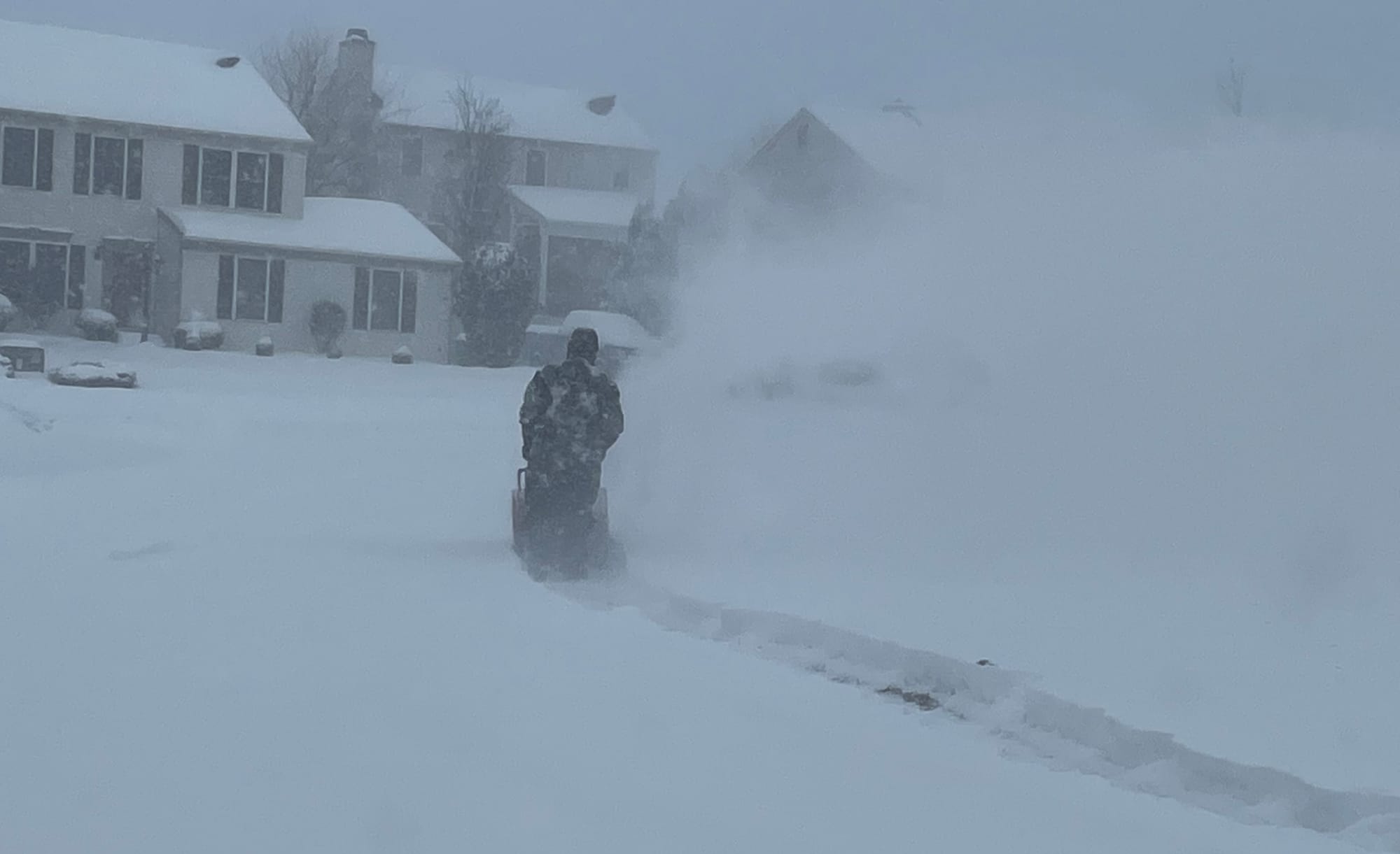 A snowblower operator at Grandview Avenue and Forest Line Road in Palmer Township clears a path during the winter storm on Su