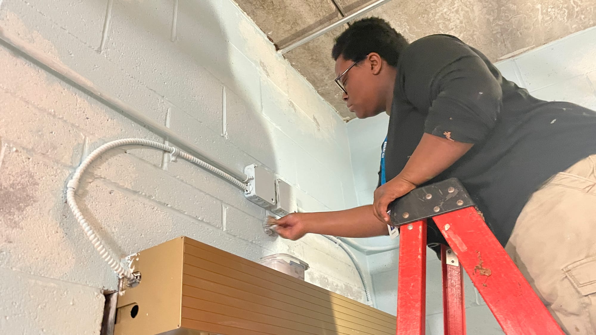 Nalah Brown, a Freedom High School student, works at fluffing the clouds.