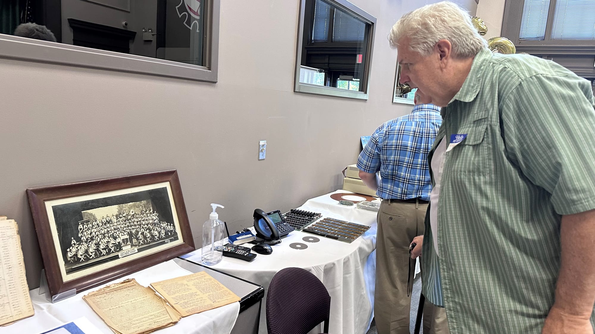 Ron Groman spots his father in a band photo at Edgeboro's 100th anniversary celebration.