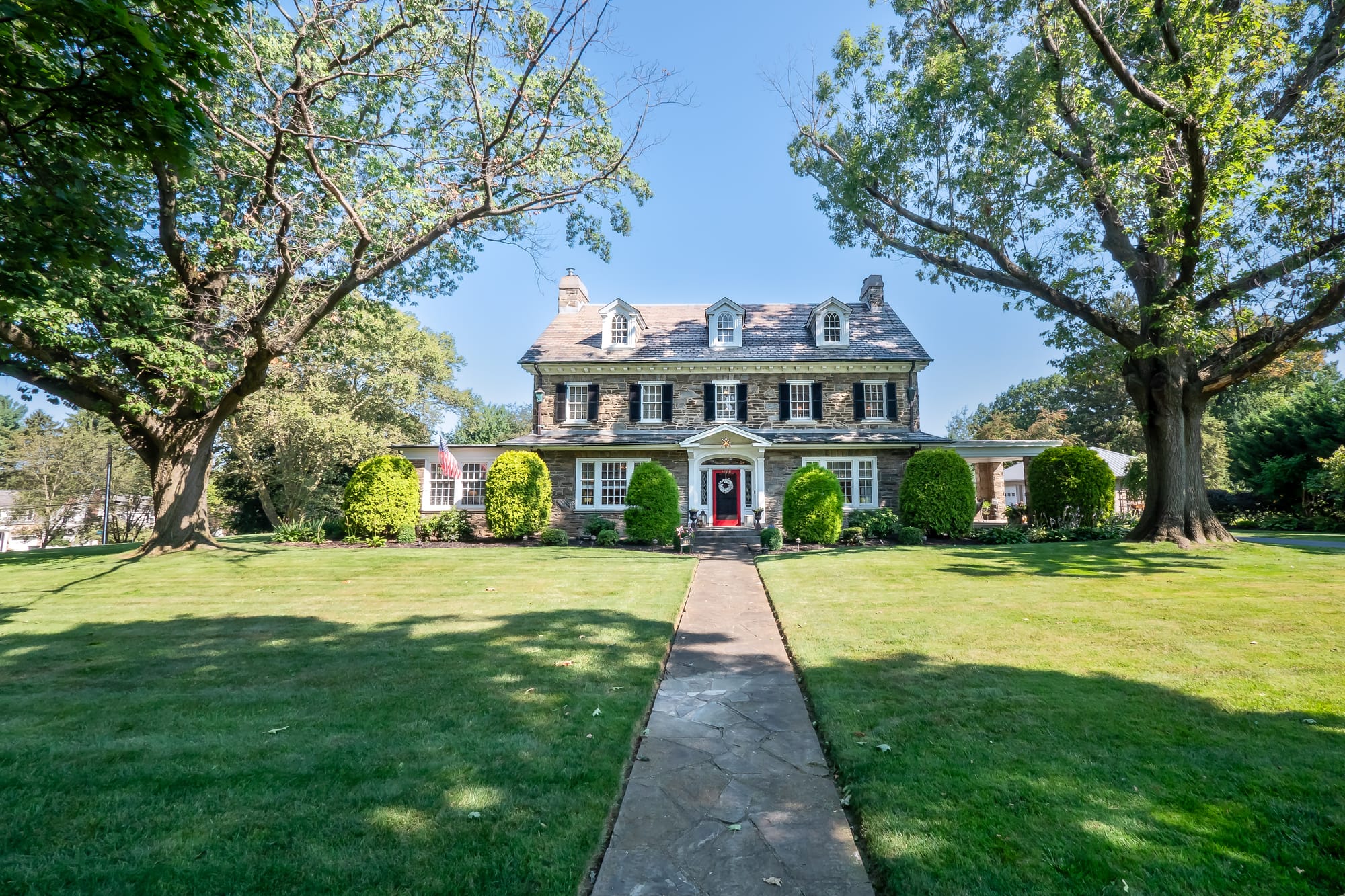 The 3-story Federal-Style Georgian Colonial mansion at 1880 W Union Boulevard sits on 1.27 acres and boasts a grand staircase
