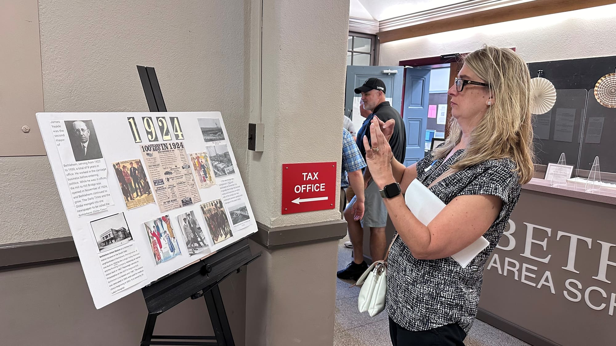 Edgeboro alumni Joan Vargo Krem takes a snapshot of a school collage for her father at the institution's 100th anniversary.