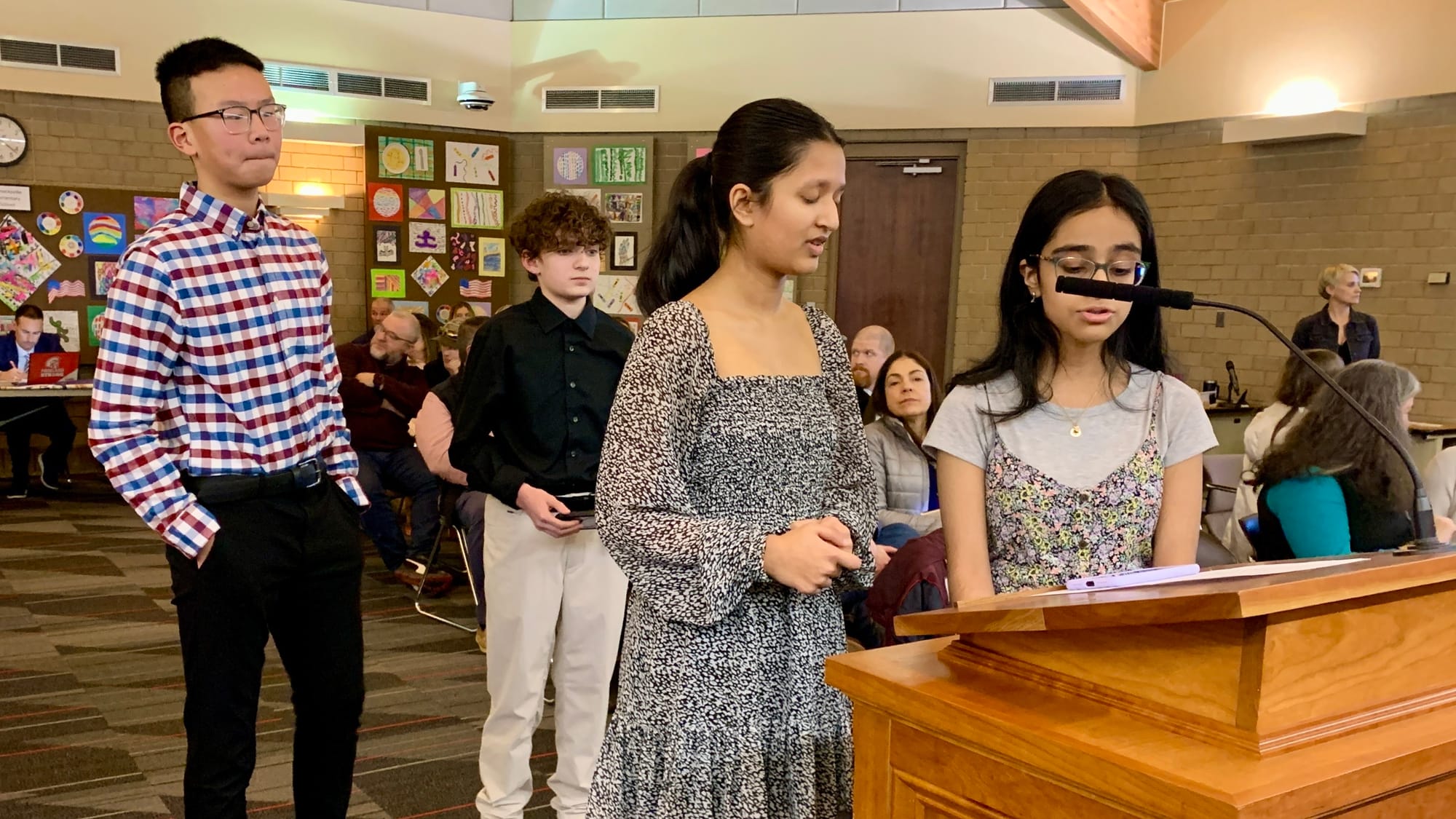 Middle school students Eric Liu, Santiago Borelli, Veda Gandhi and Aaditri Suresh present to the Parkland School Board.