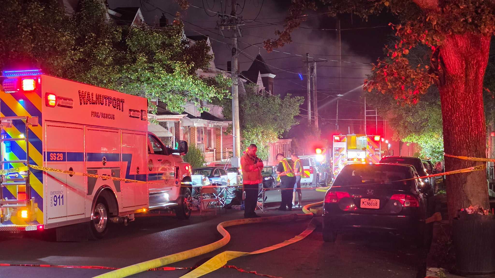 A firefighter is treated by EMS after a massive fire broke out on North Front Street near Gordon Street and Riverside Drive a