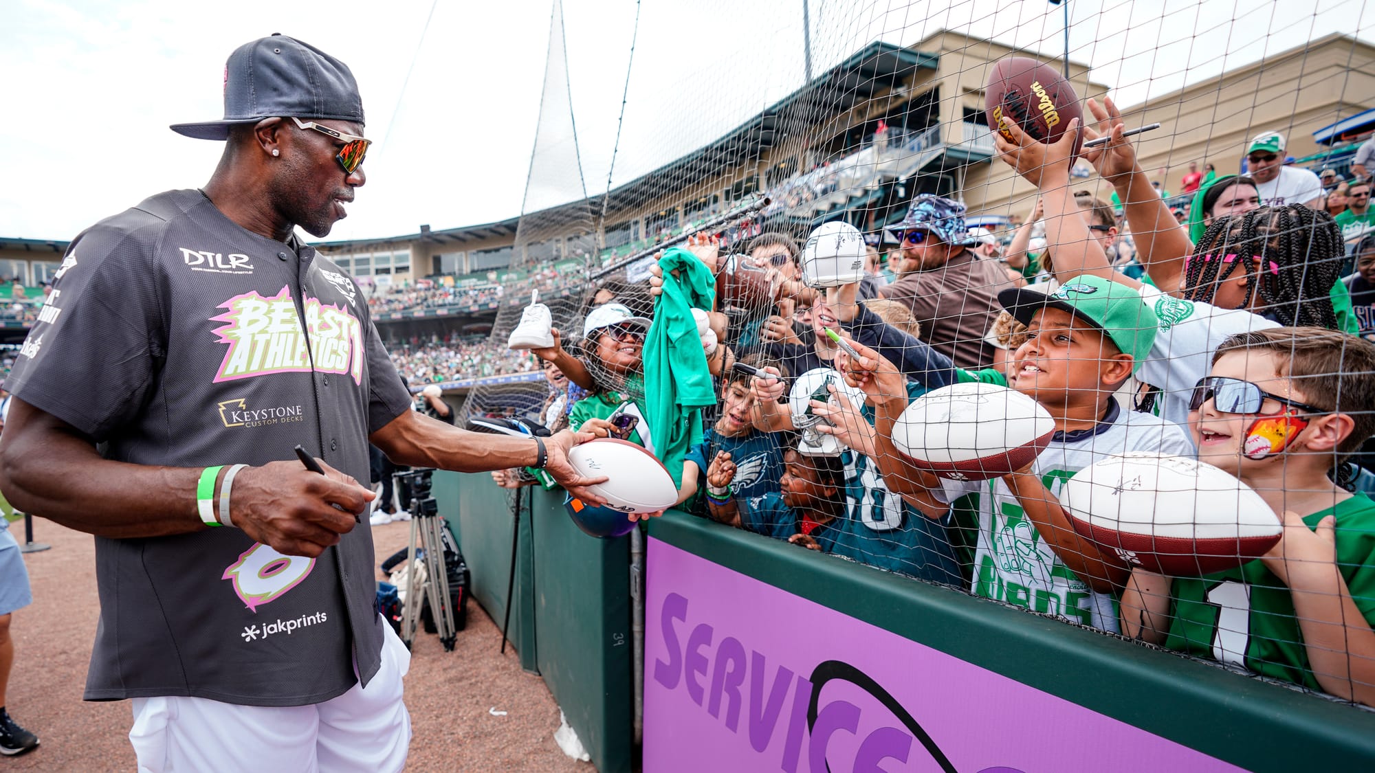 Terrell Owens signs autographs. The annual DeVonta Smith Celebrity Softball Game featuring Philadelphia Eagles and other athl