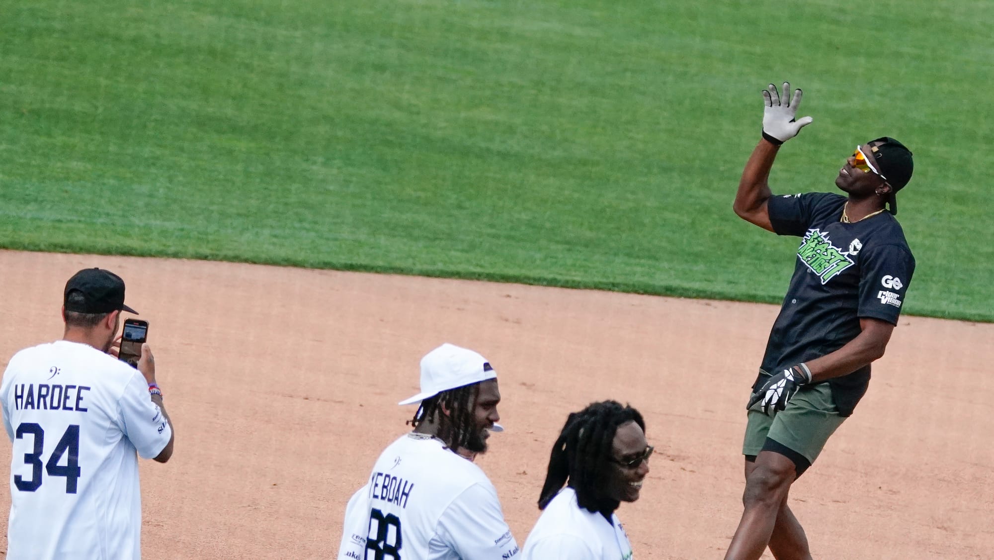 Terrell Owens tells the crowd he cannot hear them. The 2nd annual DeVonta Smith Celebrity Softball Game was held at Coca-Cola