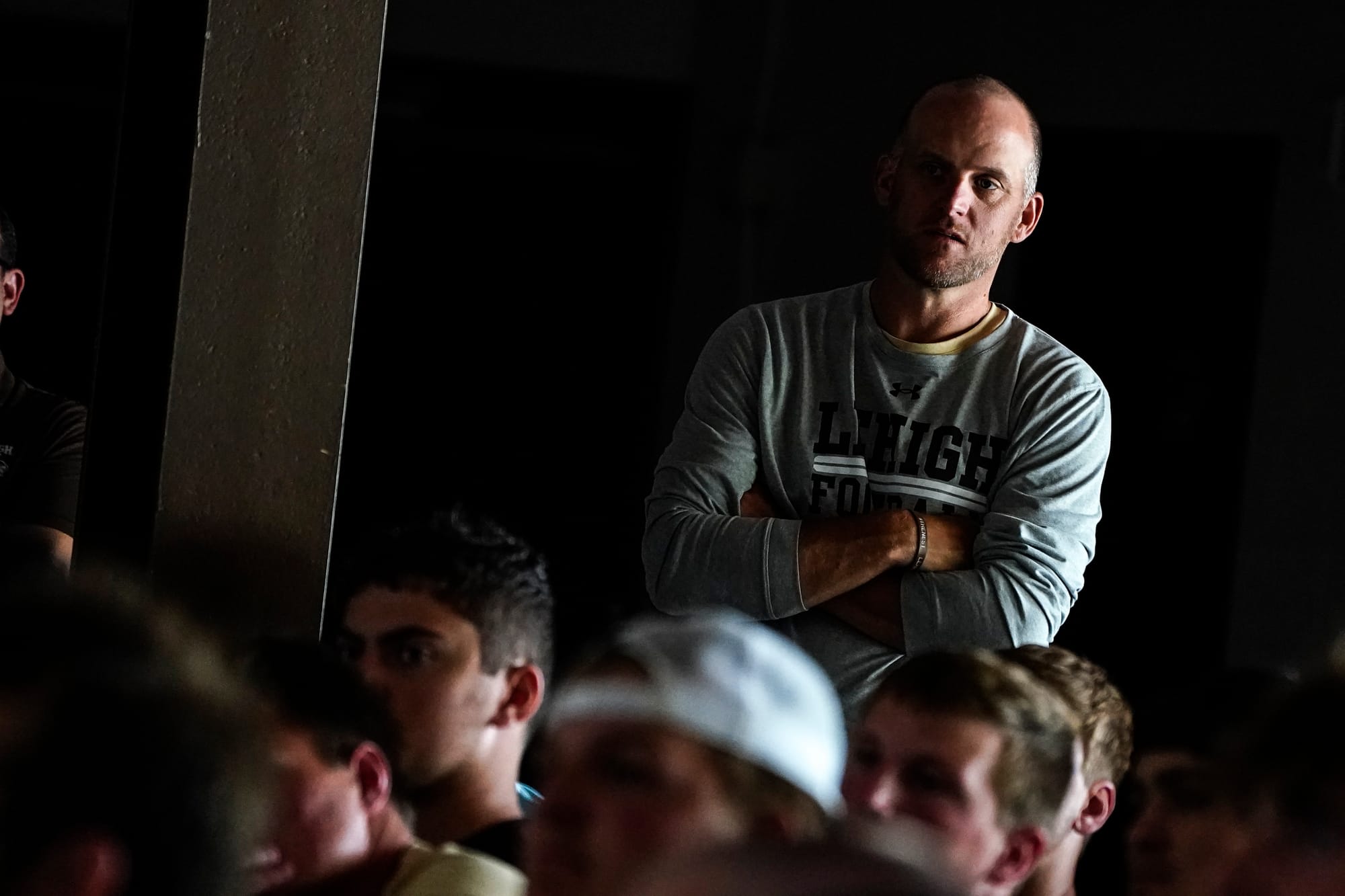 Lehigh football coach Kevin Cahill listens to SEAL team members. U.S. Special Forces members including U.S. Navy SEALs skydiv