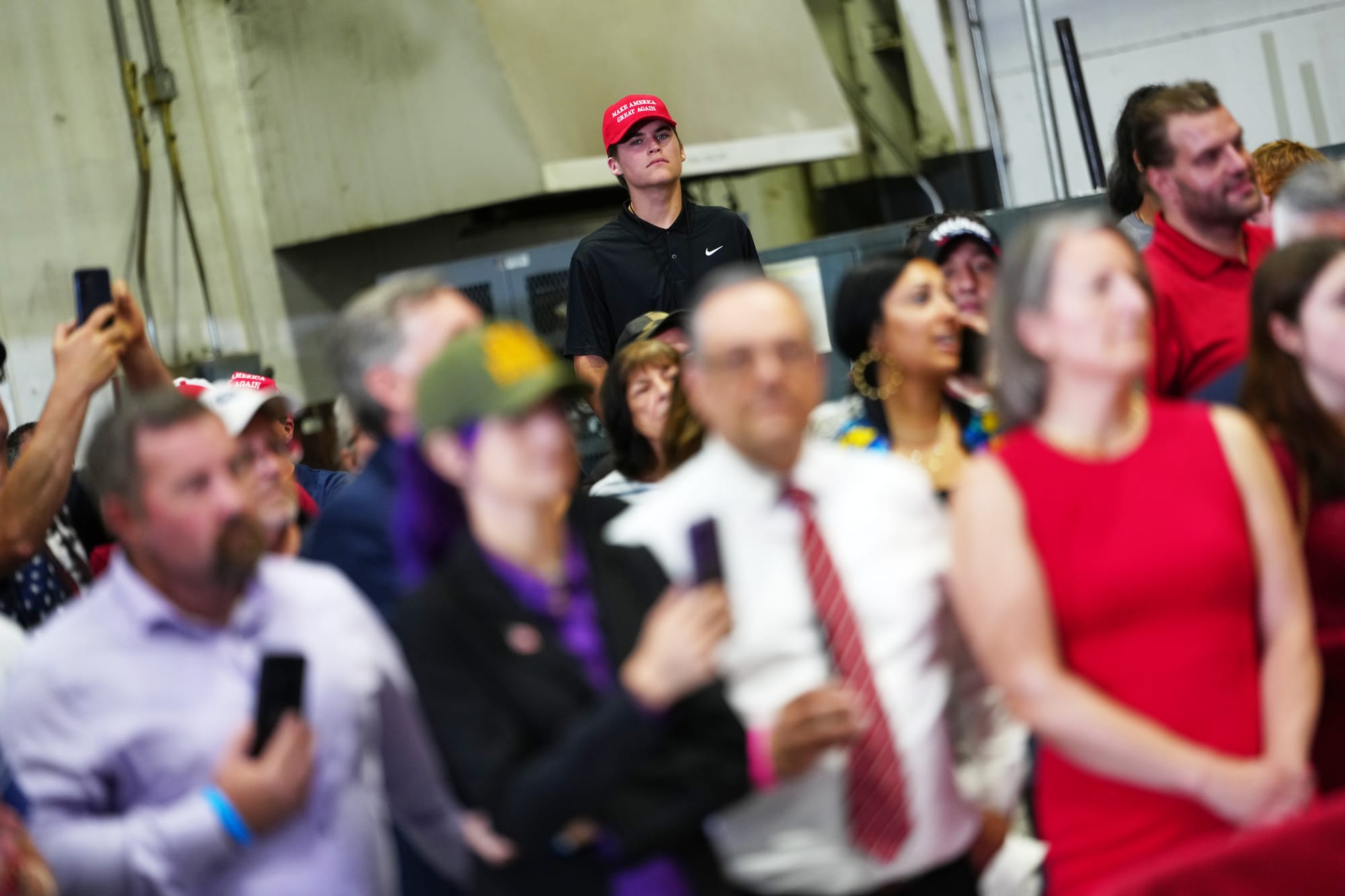 A crowd of people wait for President Donald Trump to speak at a Mack Trucks facility, Tuesday, June 23, 2026, in Macungie, Pa