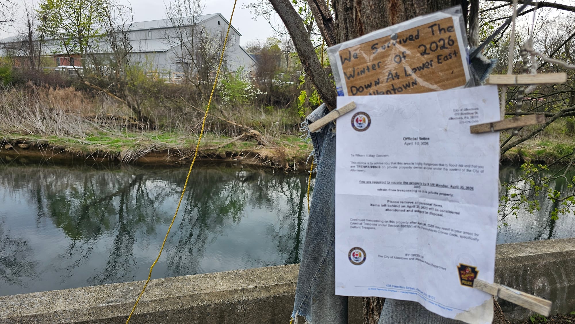 City crews on Friday, April 9, posted signs at a homeless camp along the Little Lehigh Creek to warn residents they will be e