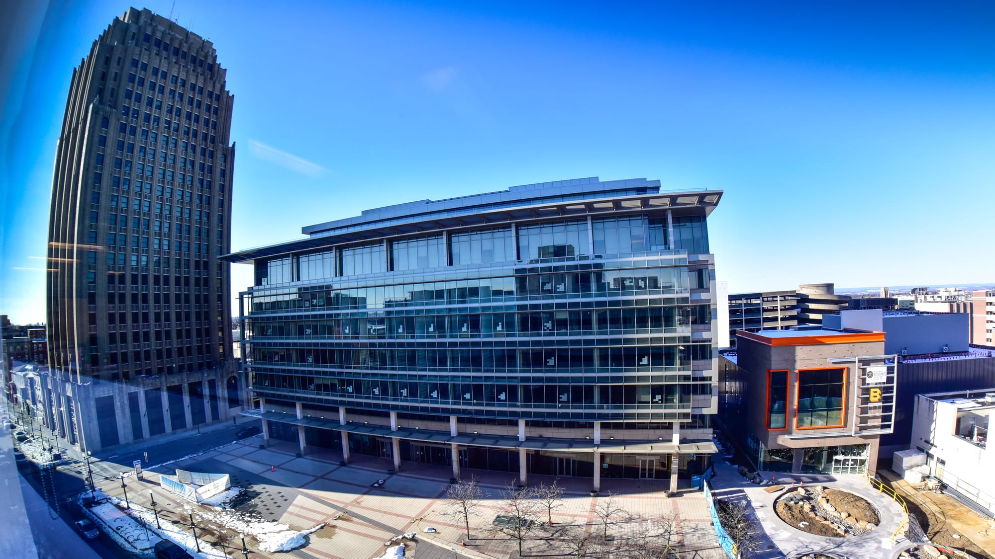 The new Da Vinci Science Center is at right with the orange trim. Representatives of the Da Vinci Science Center lead members