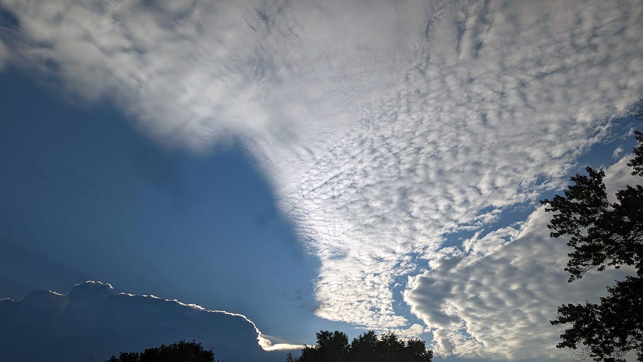Sunrise through clouds building over Allentown on Friday, July 14, 2023.