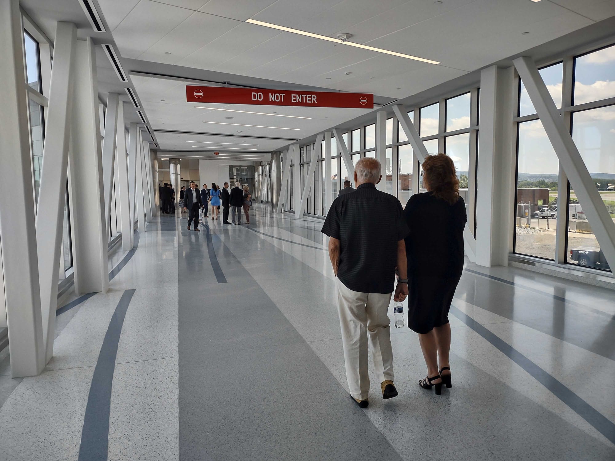 Guests tour the newly opened connector bridge at Lehigh Valley International Airport on Friday, July 28, 2023. Staff with the
