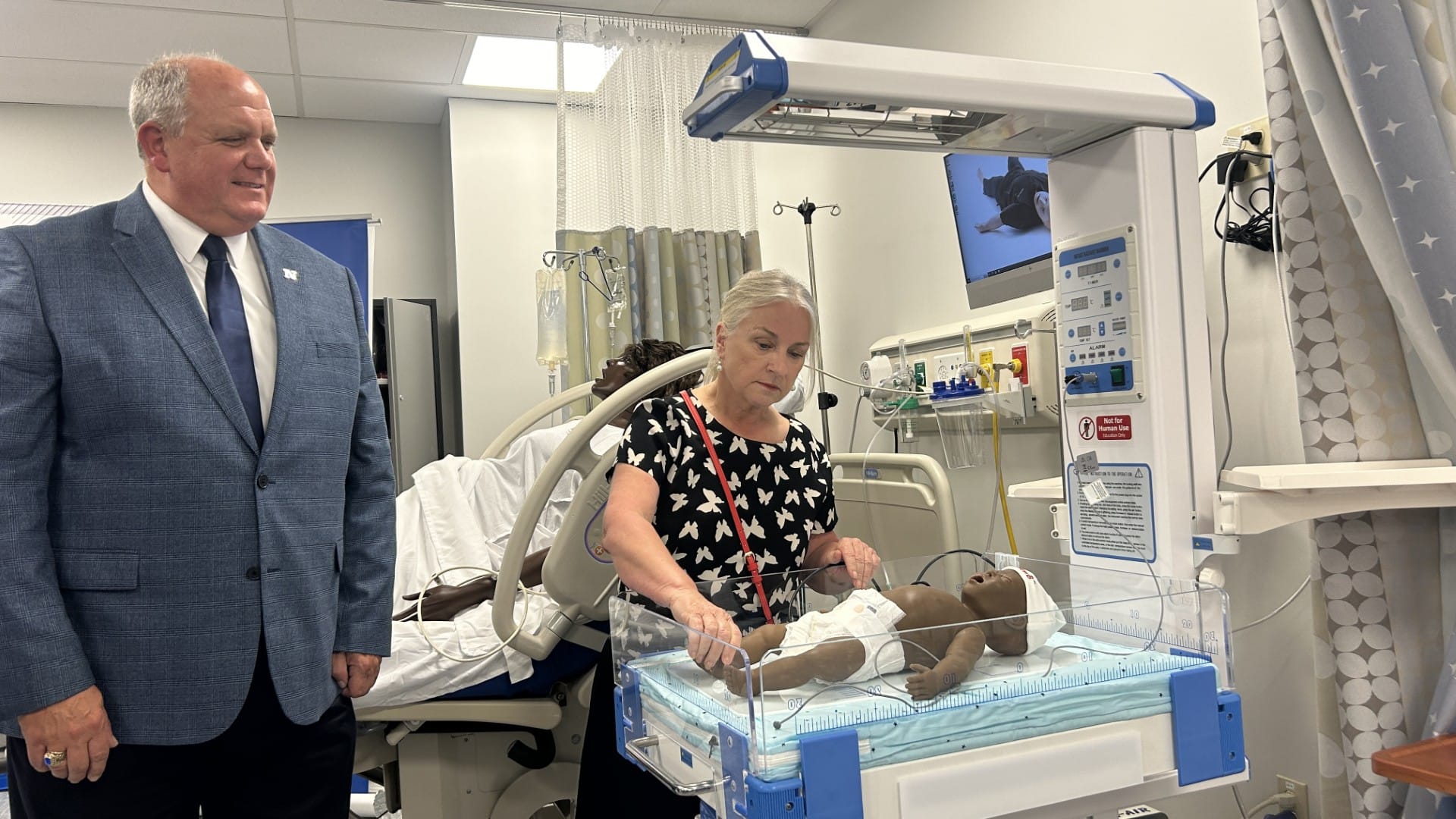 Northampton Community College President David Ruth and Congresswoman Susan Wild check out the new simulations at the Interdis