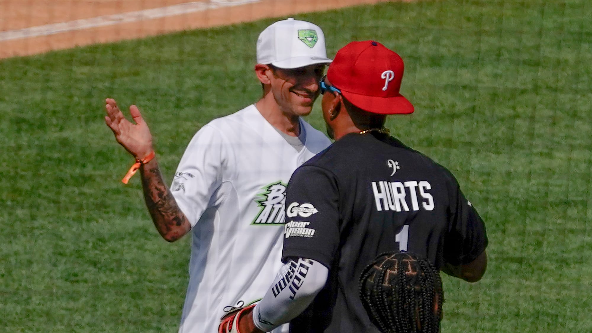 Allentown Mayor Matt Tuerk, left, gets a high-five from Jalen Hurts of the Eagles. The 2nd annual DeVonta Smith Celebrity Sof