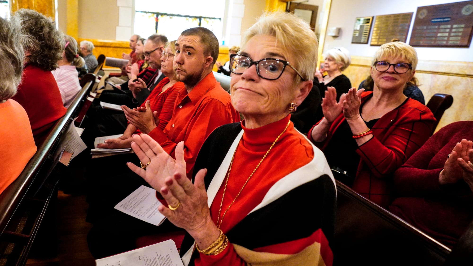 Congregants clap at the conclusion of services. A Thanksgiving and Leave-Taking service was held at St. John's Windish Evange