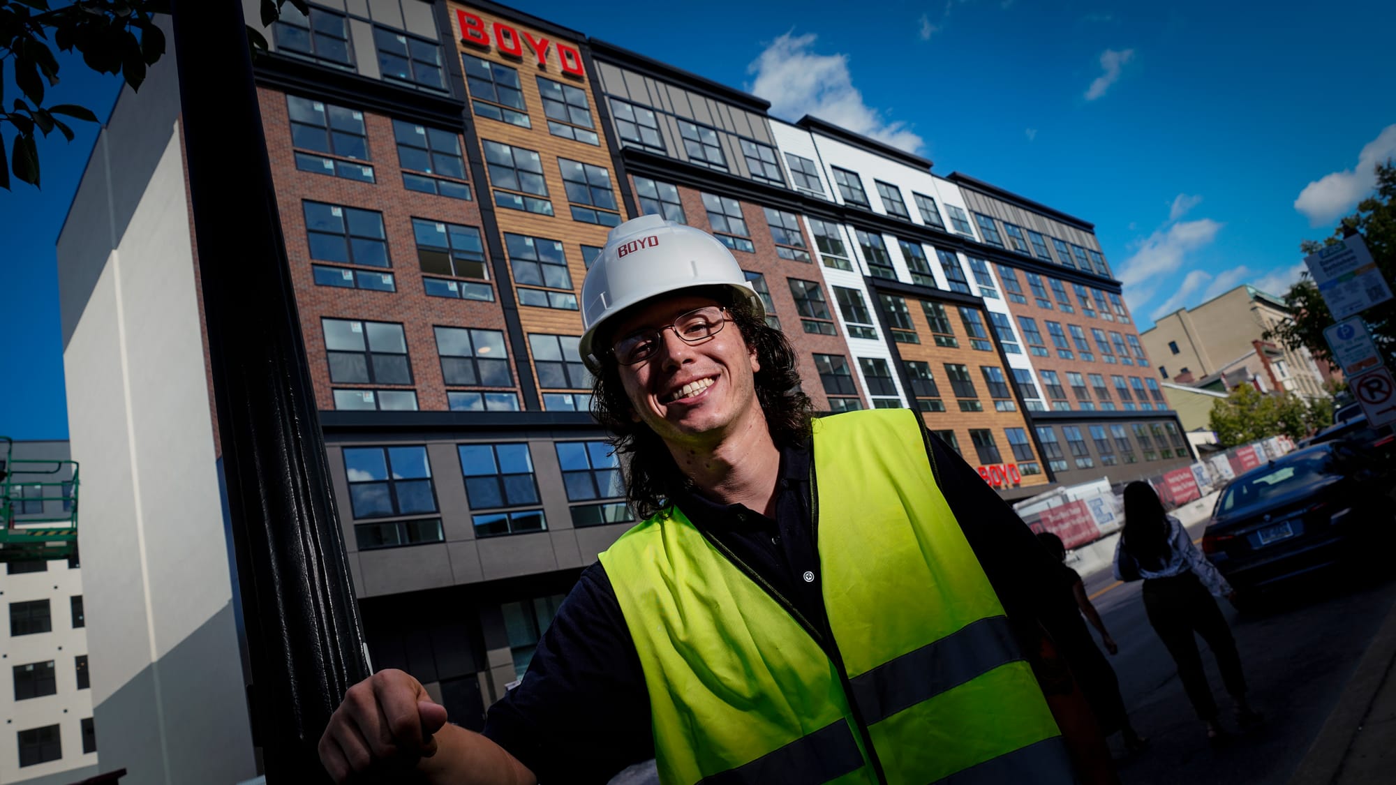 Zachary Fortier, community manager for Dream Boyd Theatre, stands outside the former movie theater on West Broad Street in Be