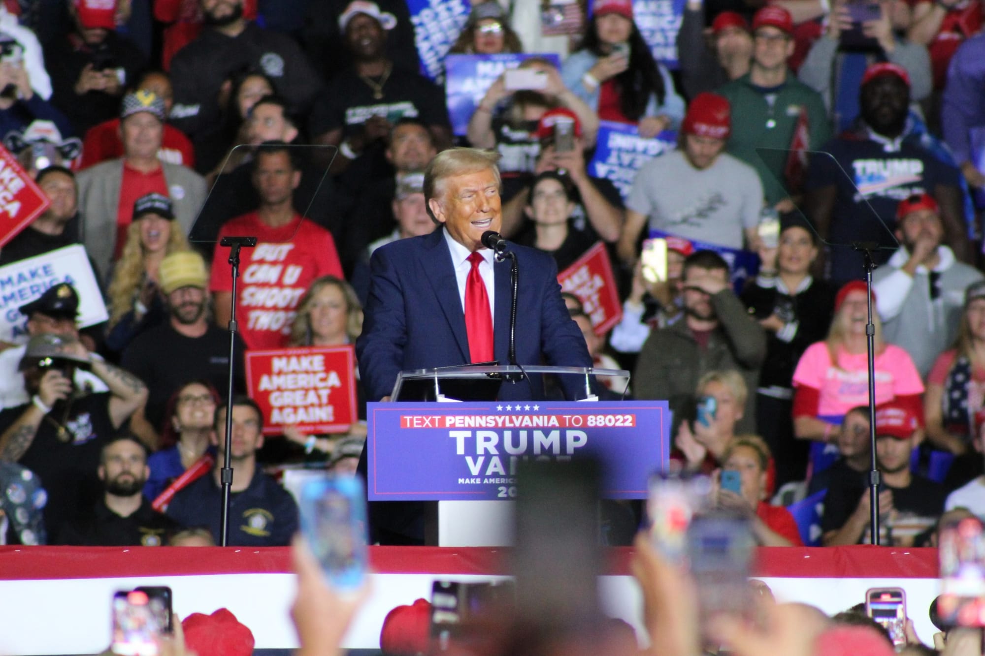 Former President Donald Trump takes the stage at the PPL Center during a Tuesday night rally in Allentown.
