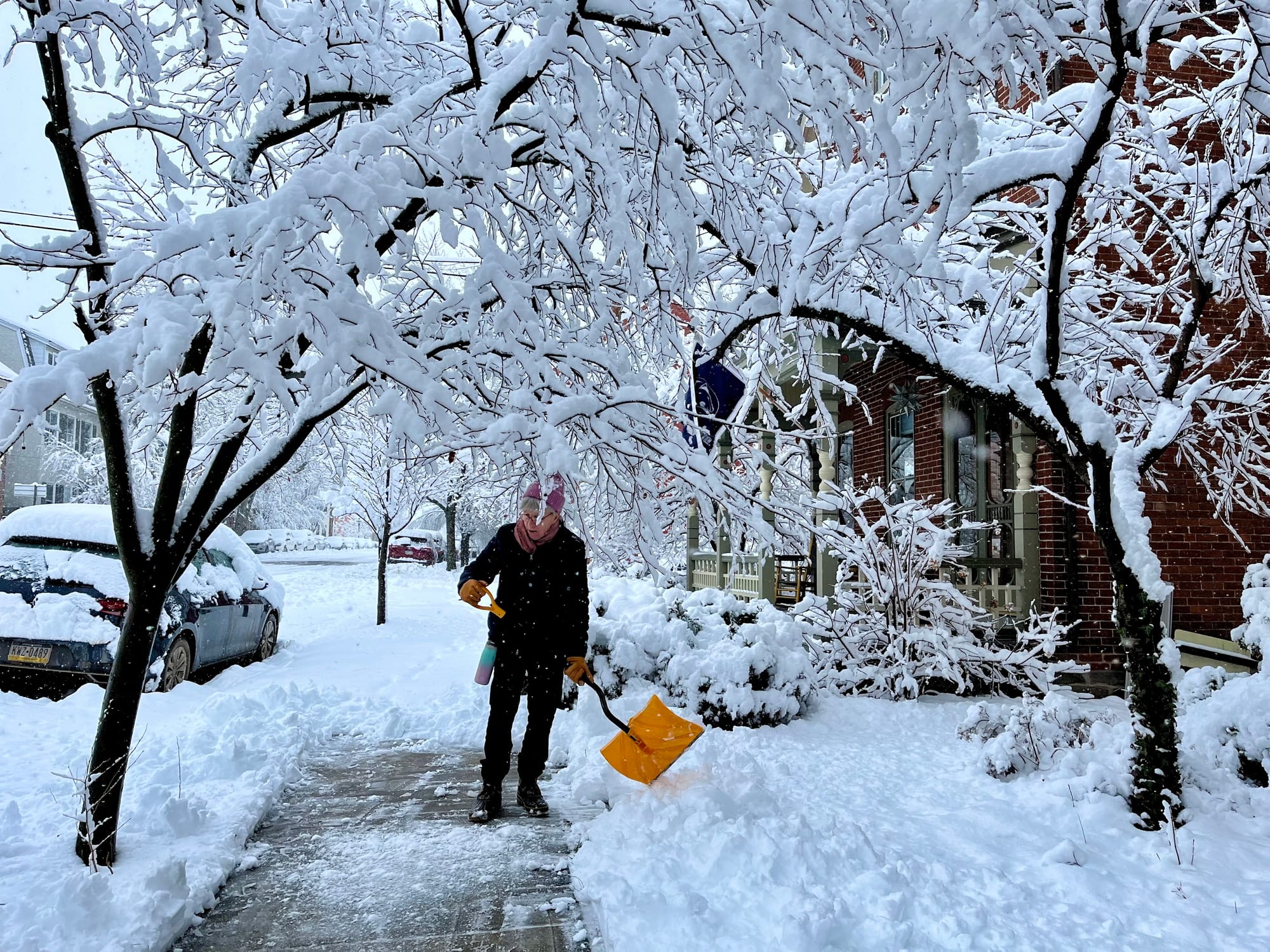 75-year-old West Bethlehem resident Jeanne Mater shovels her front walk on 2nd Ave after a winter storm moved through the are