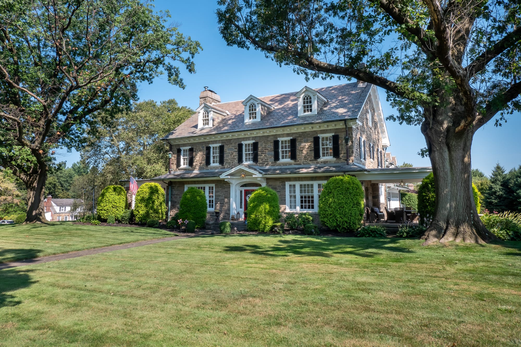 The 3-story Federal-Style Georgian Colonial mansion at 1880 W Union Boulevard sits on 1.27 acres and boasts a grand staircase