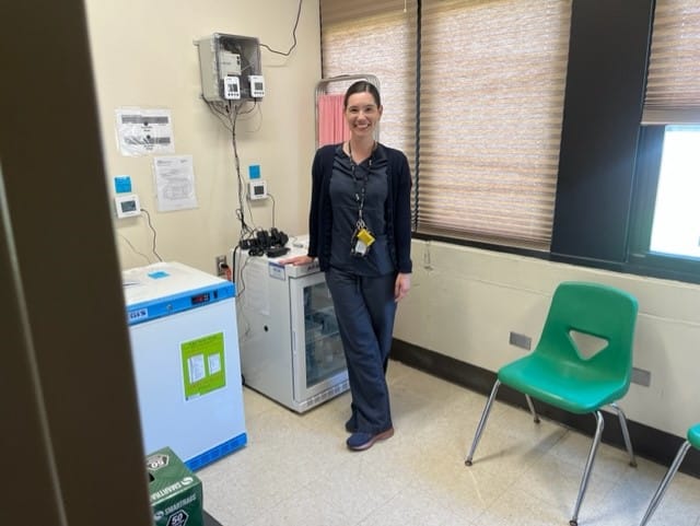 Crystal Perez, Assistant Director of Health Services with Allentown School District, visits the vaccine unit at South Mountai