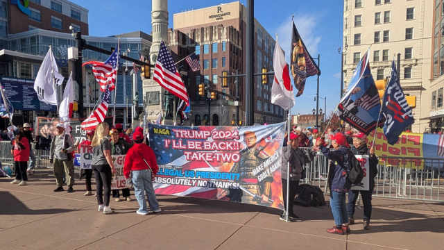 Trump supporters parade with their banners and flags hours before the rally.