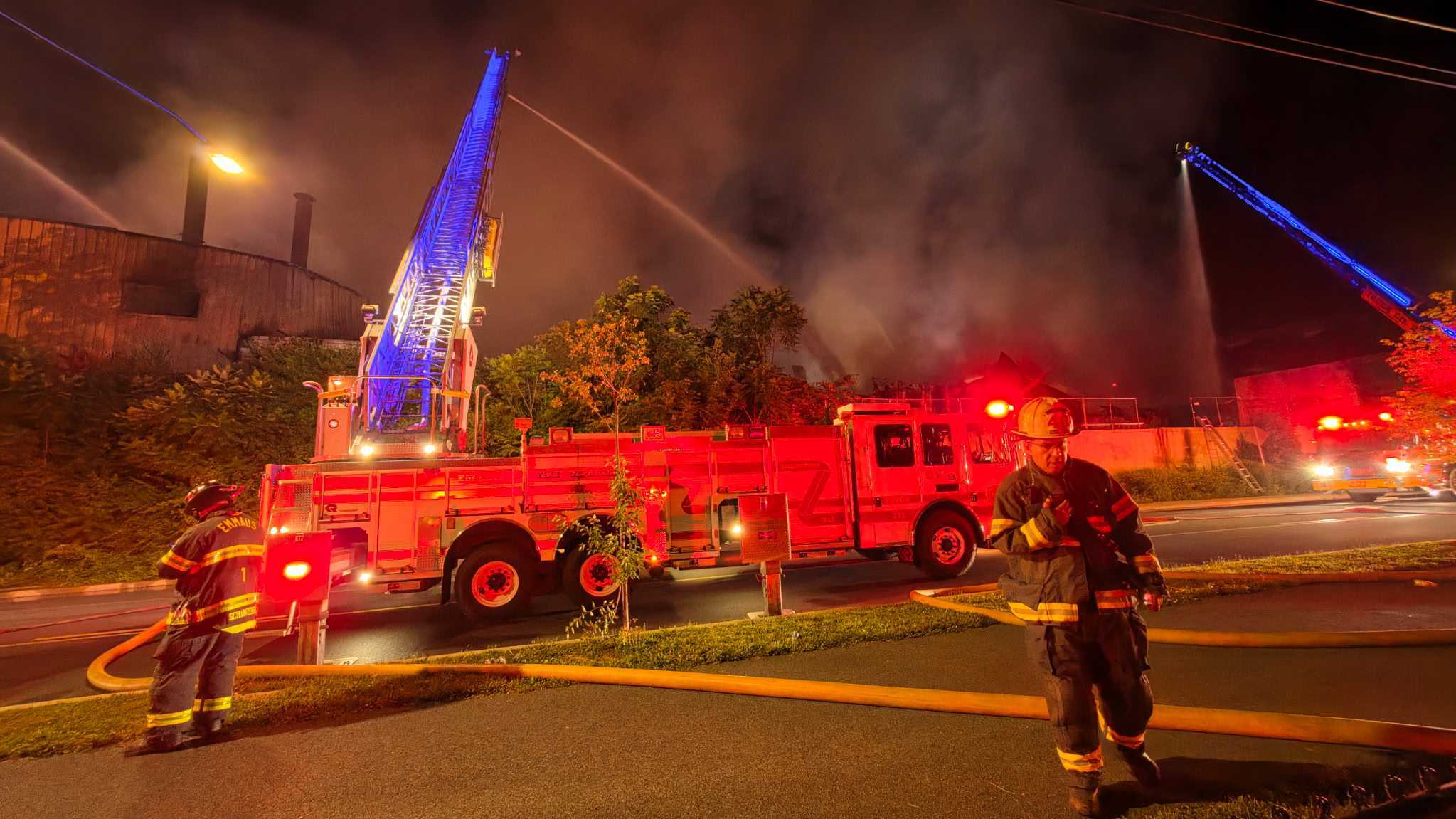 Allentown Fire Chief Efrain Agosto on Riverside Drive Wednesday night as a massive fire burns in the area.
