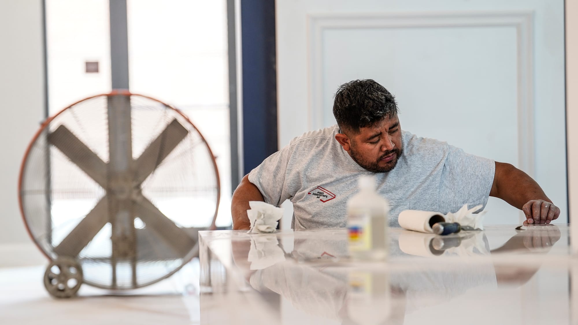 A workman sets tile at the Dream Boyd Theatre project on West Broad Street in Bethlehem on Tuesday, September 10, 2024. Scene