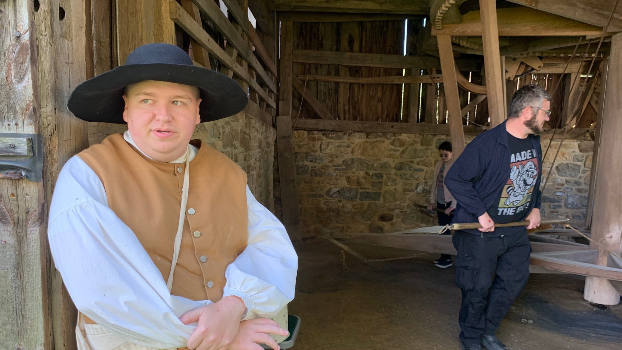 Historical Bethlehem Museum employee Schuyler Evans teaches visitors about the Horsepower Wheel, which would operate farm equ