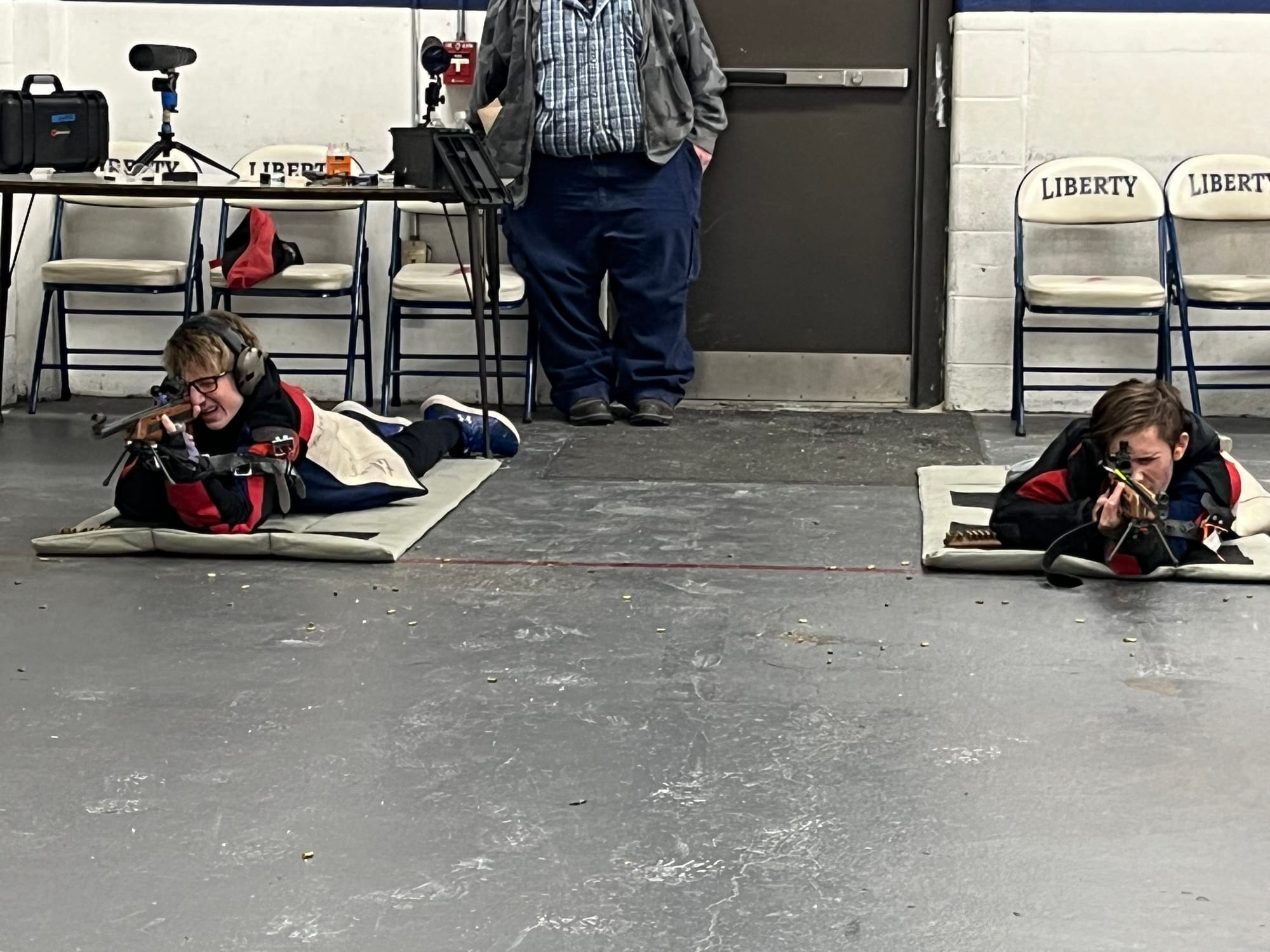 Freedom High School's Gage Landis, left, and Kaden Fredrickson sight their rifles in preparation for their relay against Emma