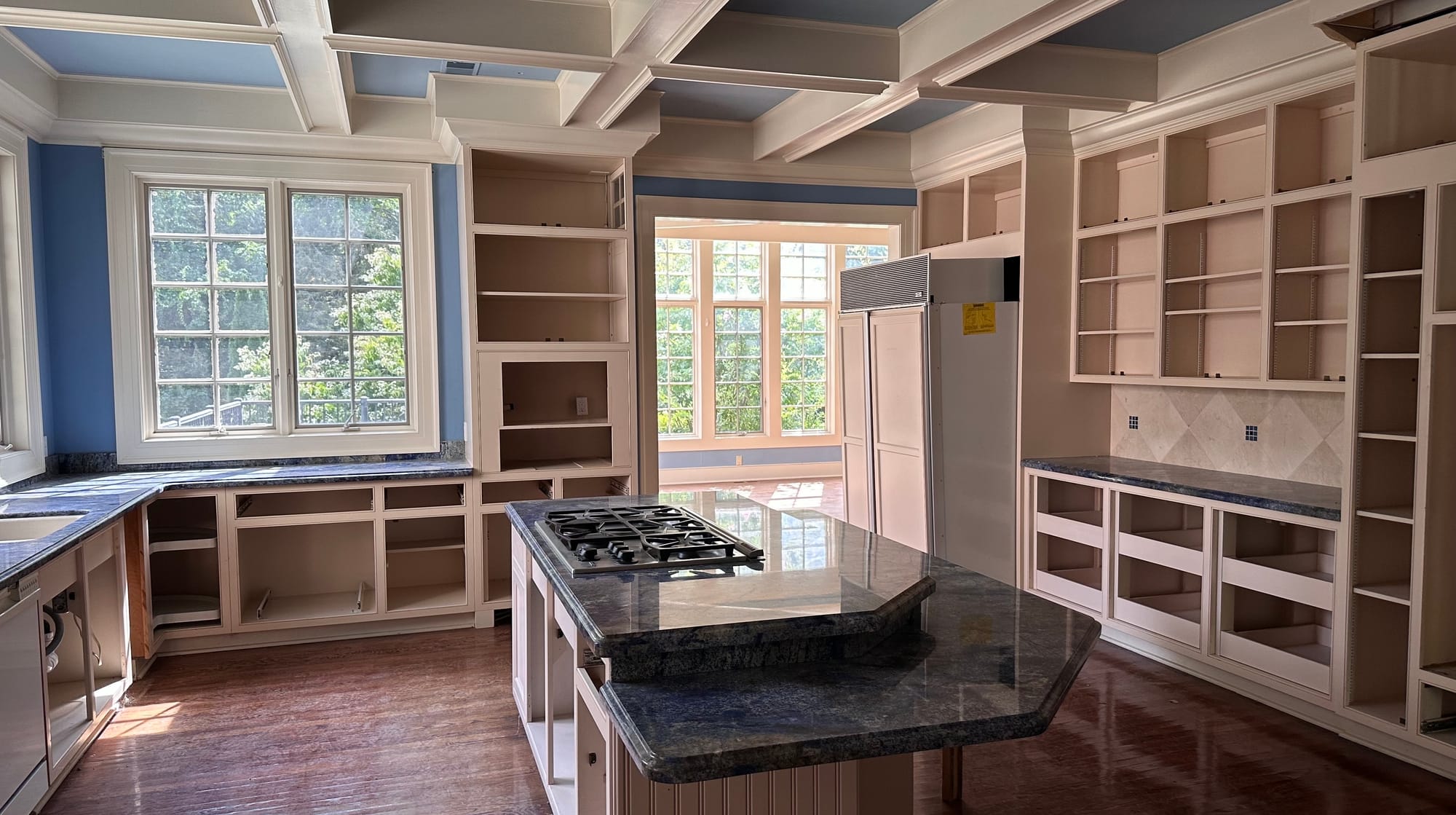 The kitchen inside 3015 Barrington Lane and adjacent sun room are one of few areas to bare color.