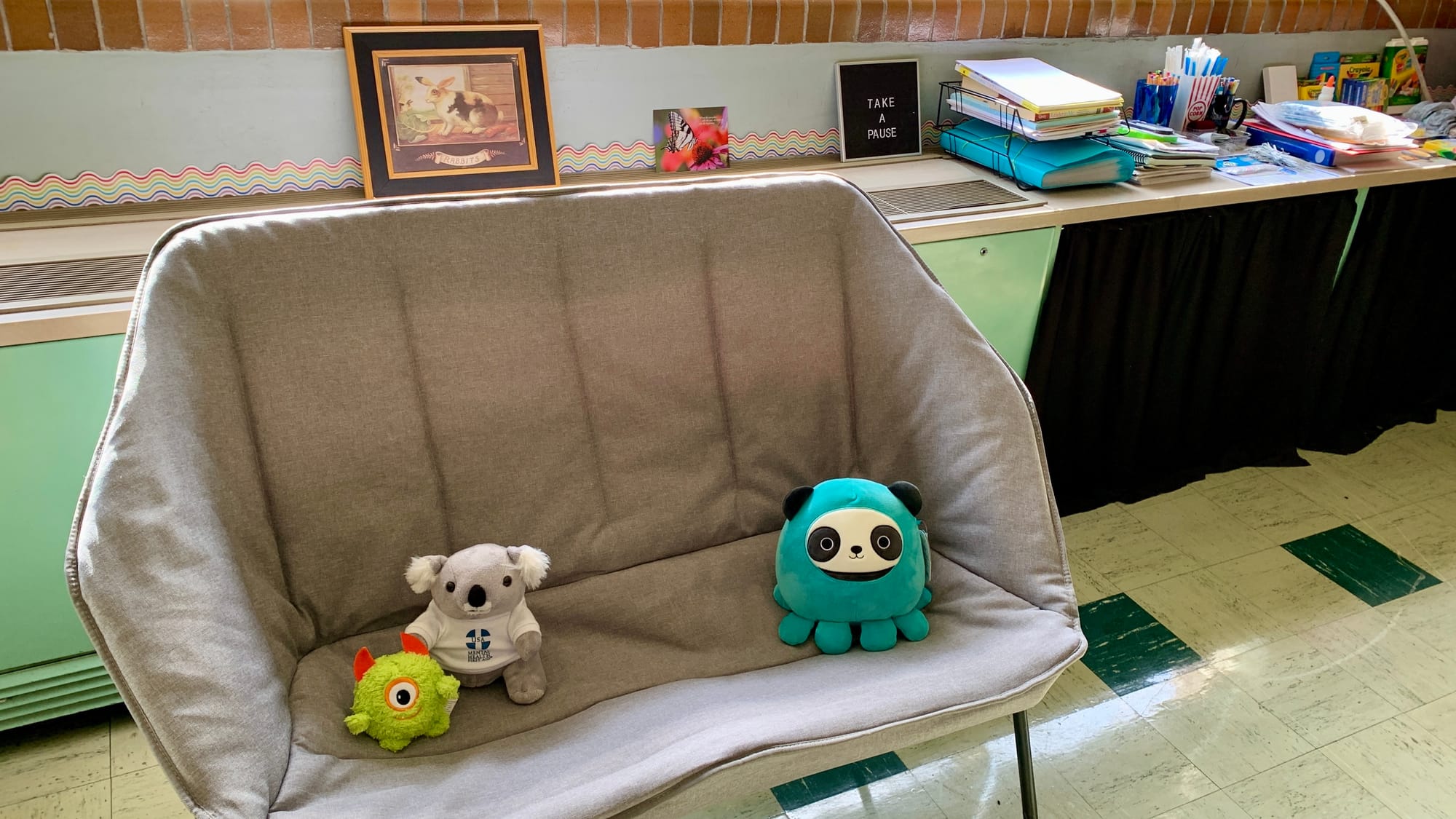 A couch with stuffed animals in the Parkland REACH Village.