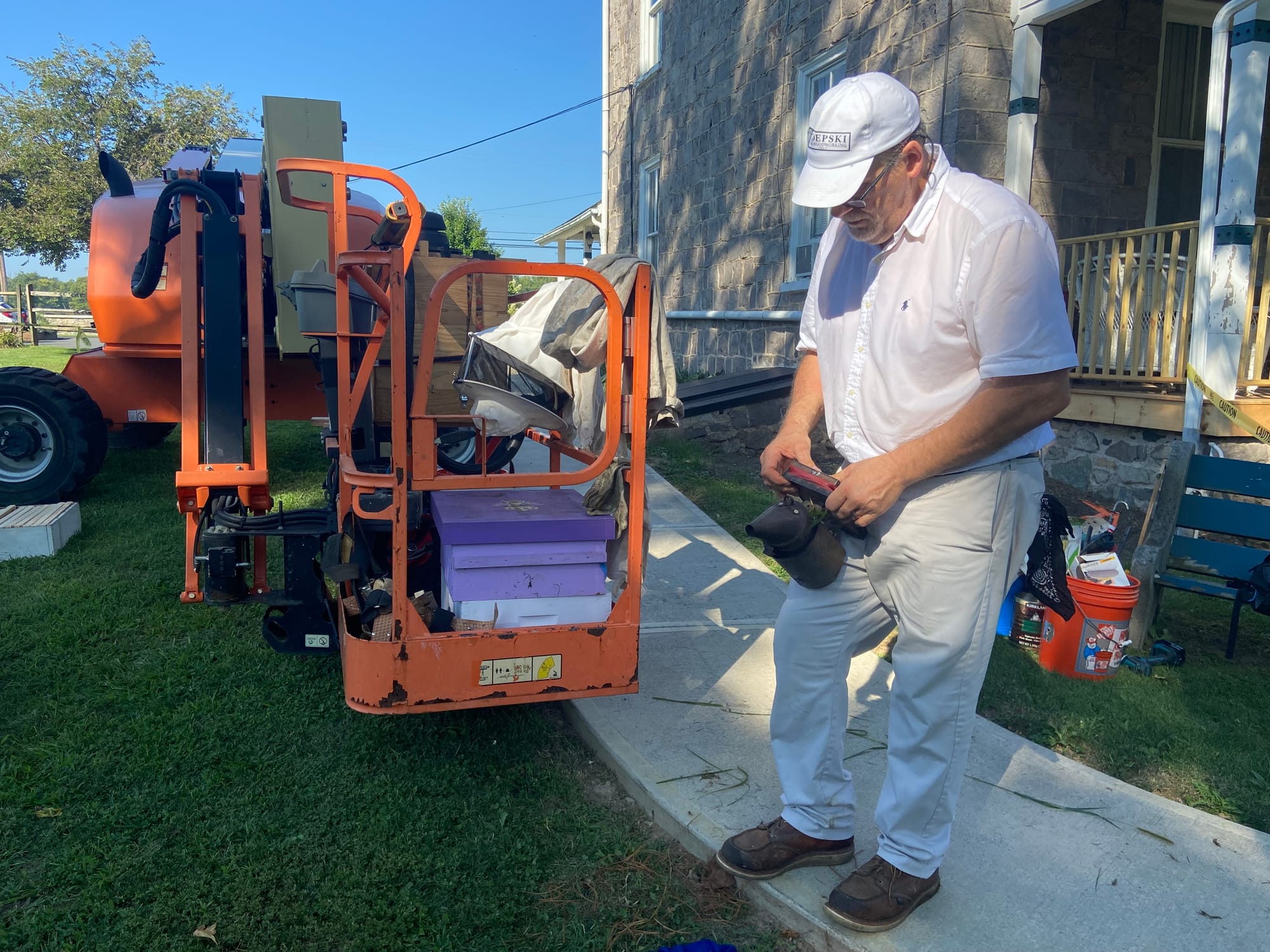 James Zdepski, a beekeeper and carpenter, removed a colony of bees Wednesday from the Riegelsville's borough hall.