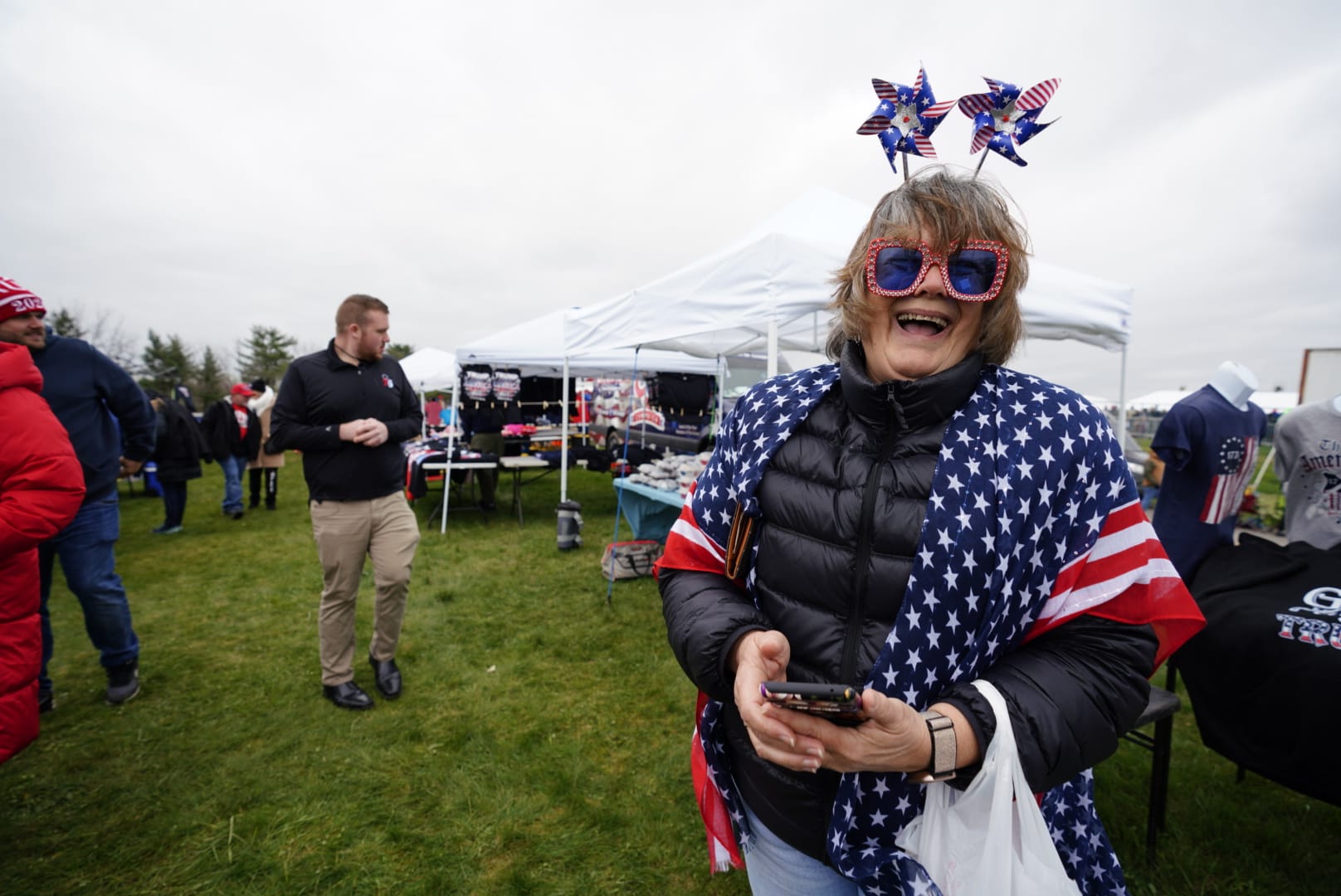 People gather ahead of Donald Trump's rally in Schnecksville, Pa. on Saturday, April 13, 2024.