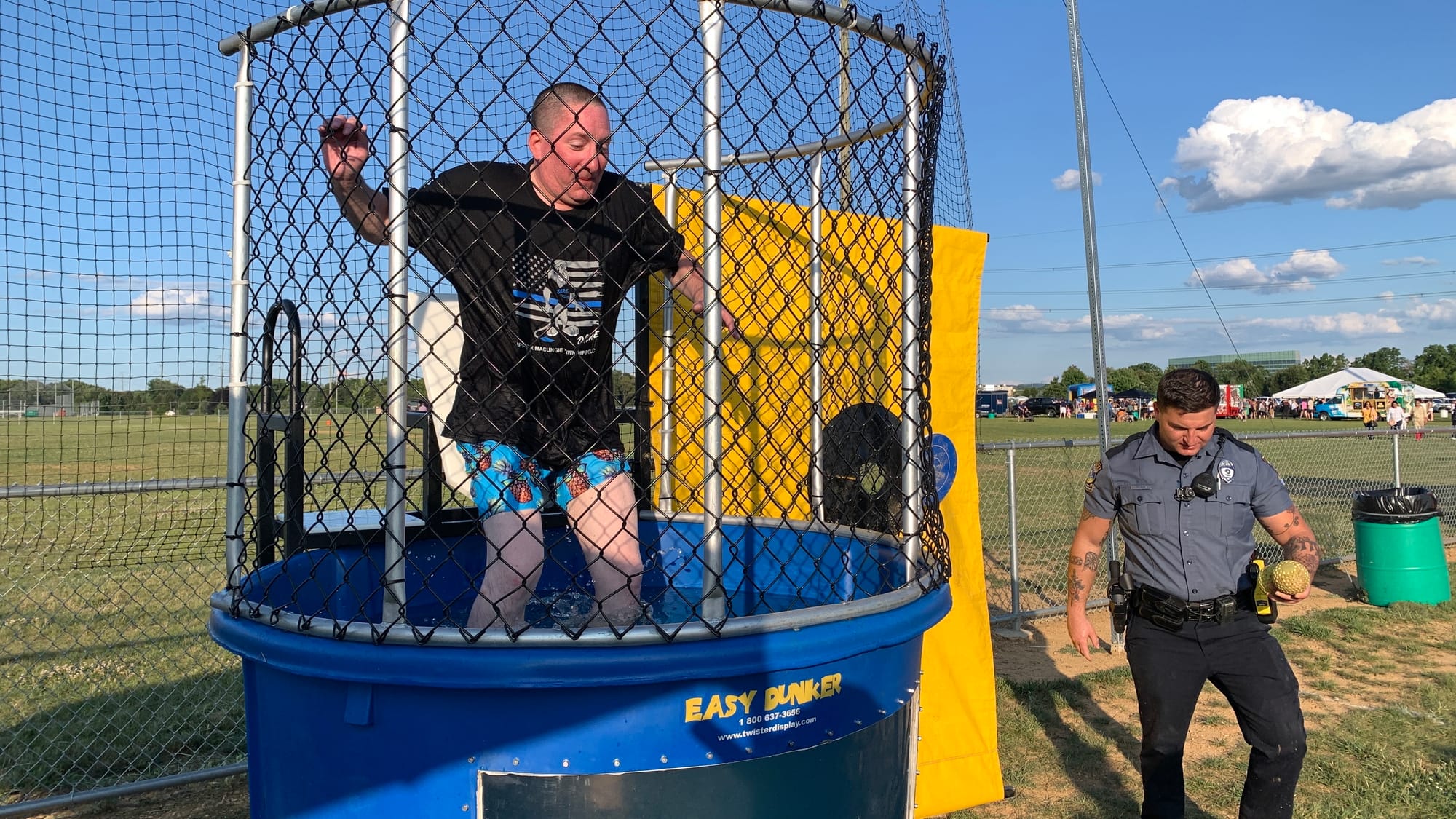 One of Upper Macungie's officers goes into the dunk tank at Upper Macungie's National Night Out event.