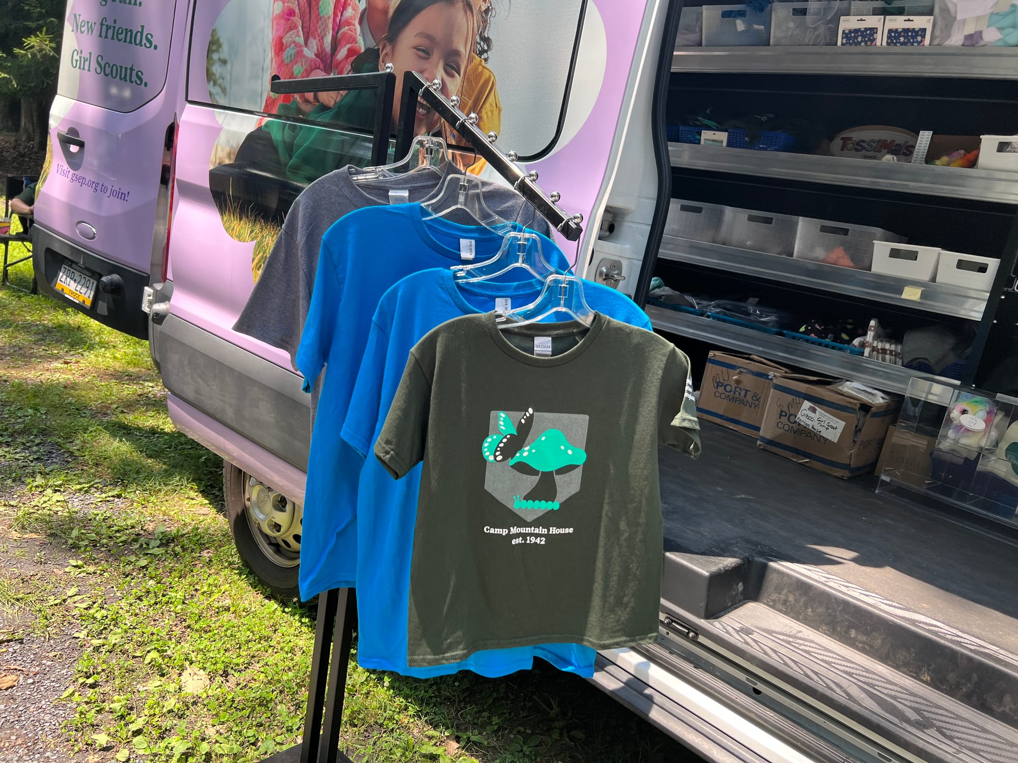 Luella sells camp shirts as well as toys and badges.