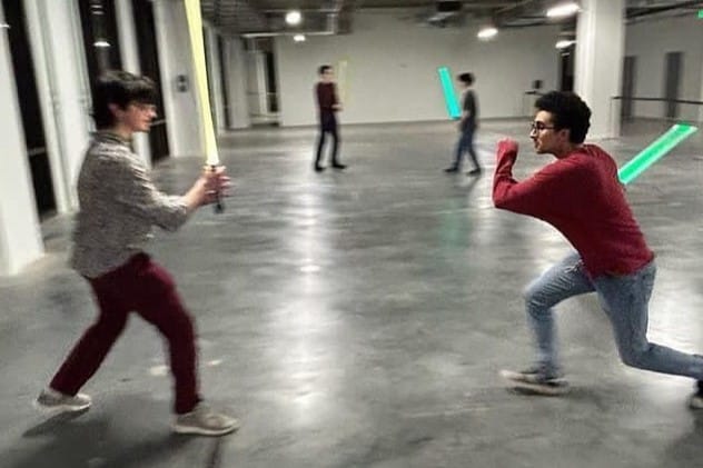 Members of the Lehigh Lightsaber Club dueling in an on-campus building