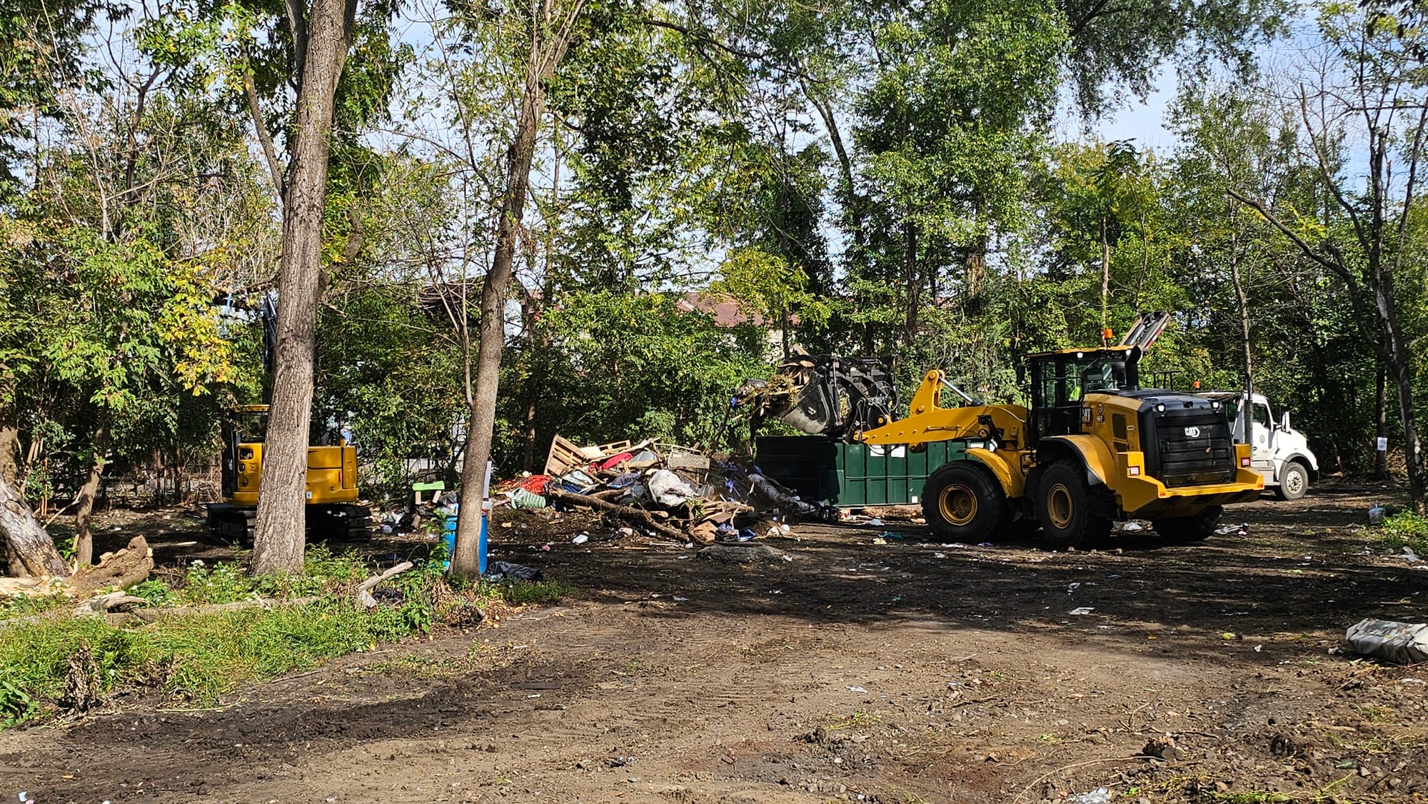 Crews clear tents and debris from an area along the Jordan Creek that became a homeless encampment after Mayor Matt Tuerk's e