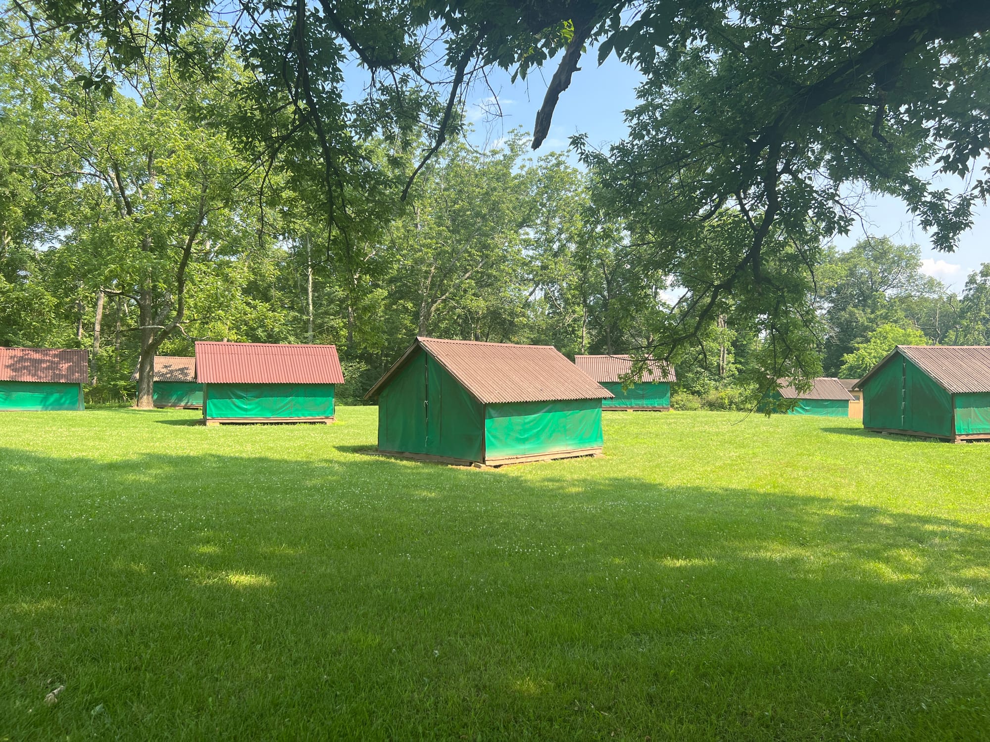 Four girls sleep in each tent, where they have cubbies to hold their stuff. The tents are all on platforms to protect from an