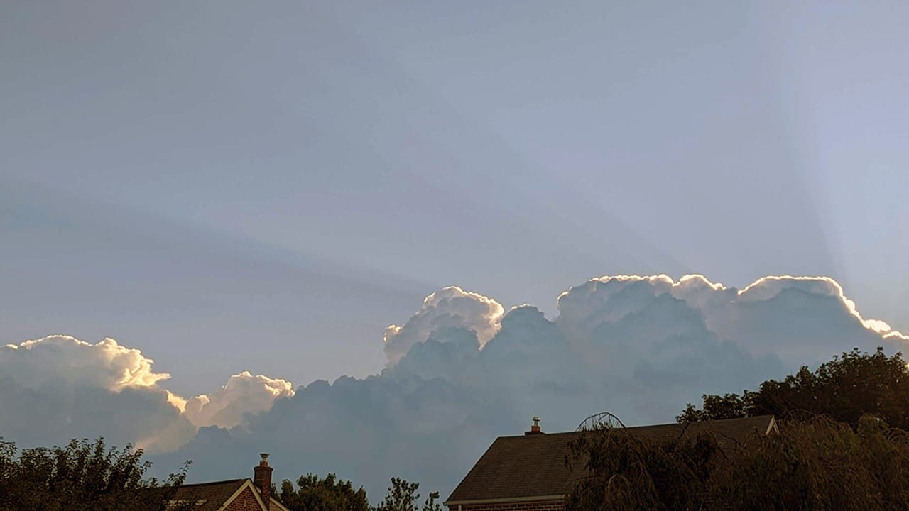 Sunrise through clouds building over Allentown on Friday, July 14, 2023.