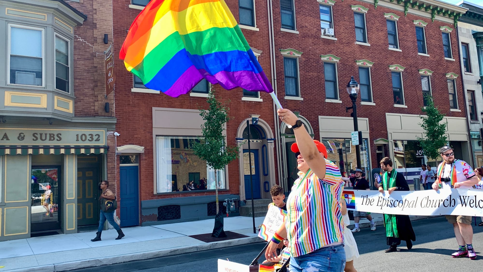 People march along Hamilton Street during Allentown's Pride Parade in August 2023.