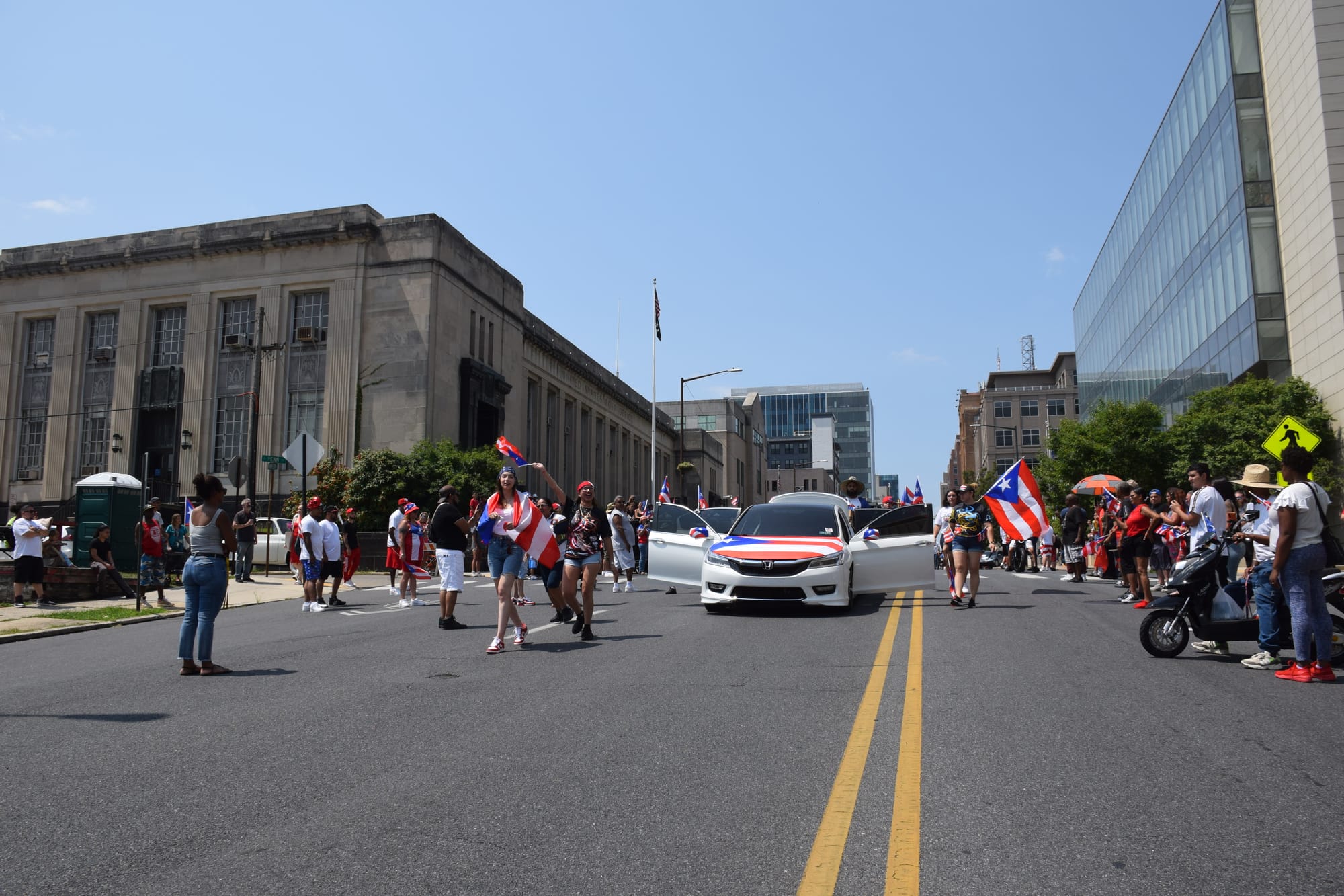 Cars and Jeeps with the Puerto Rican flag rolled through Allentown during the Puerto Rican parade and festival on July 28, 20