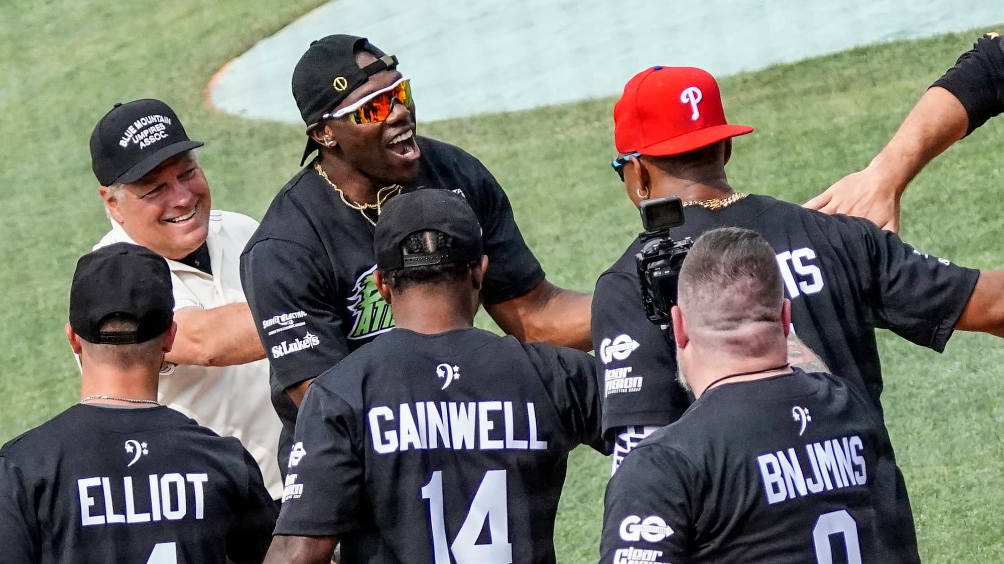 Terrell Owens is greeted at home by Jalen Hurts, Eagles quarterback. The 2nd annual DeVonta Smith Celebrity Softball Game was