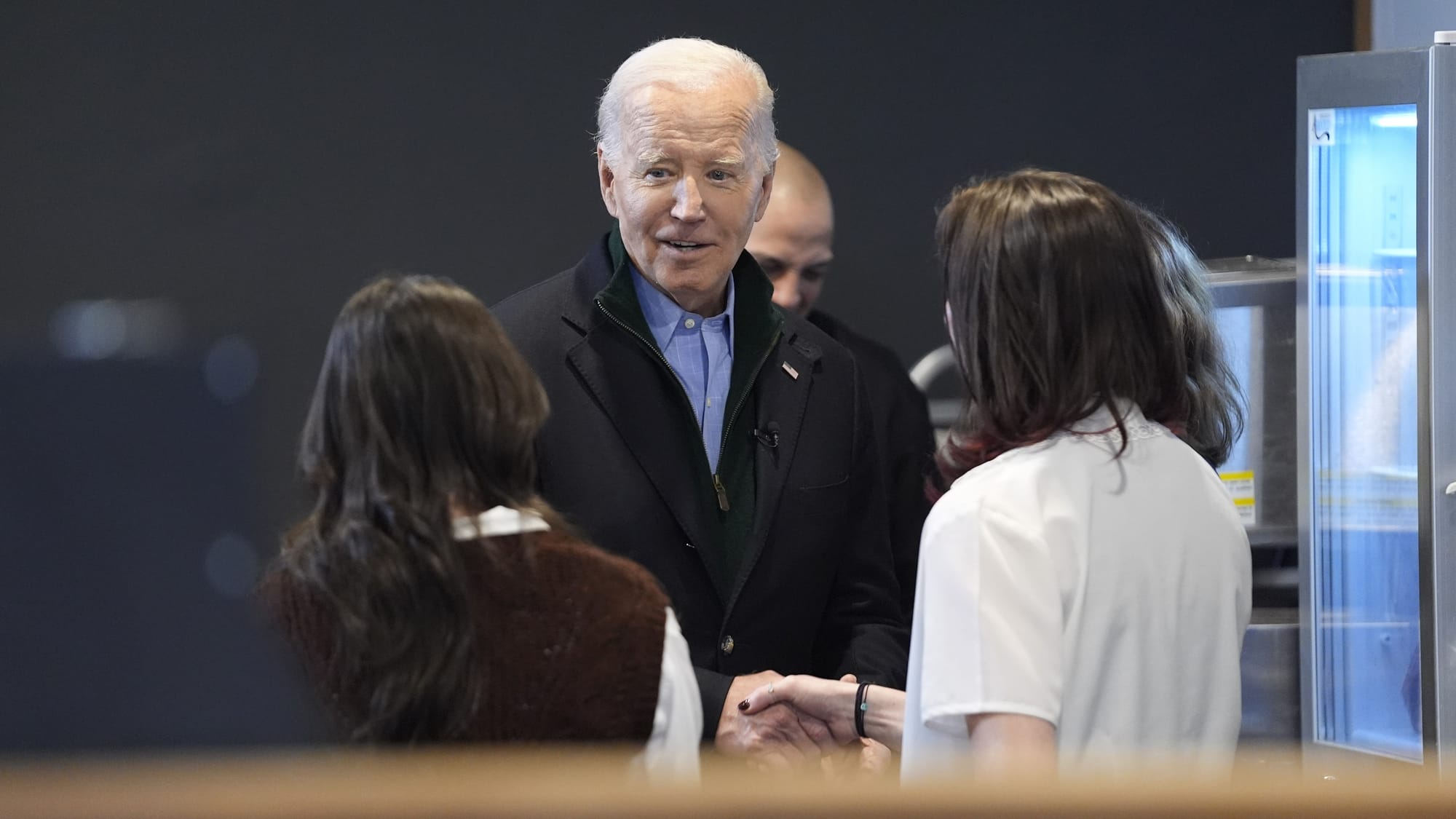 President Joe Biden talks to women in an Emmaus coffeehouse on Jan. 12, 2024.
