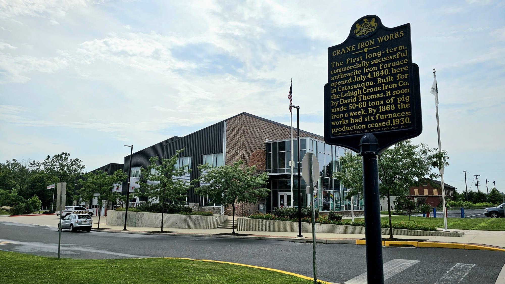 A marker near the Catasauqua municipal complex details the property's history as the former site of Crane Iron Works.