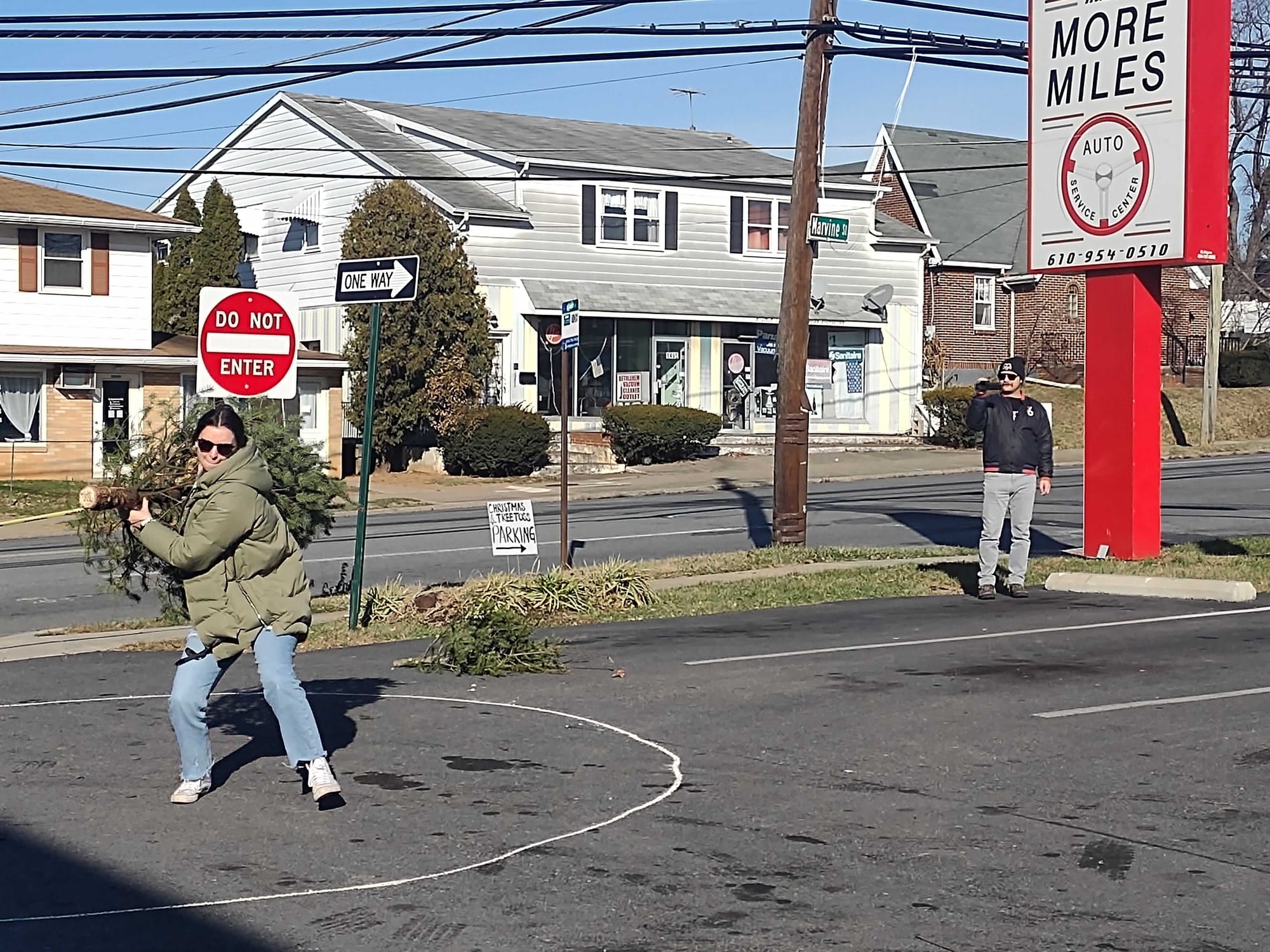 Melissa Mayer, of Bath, winds up for her turn at the annual Christmas Tree Toss hosted at More Miles Automotive in Bethlehem.