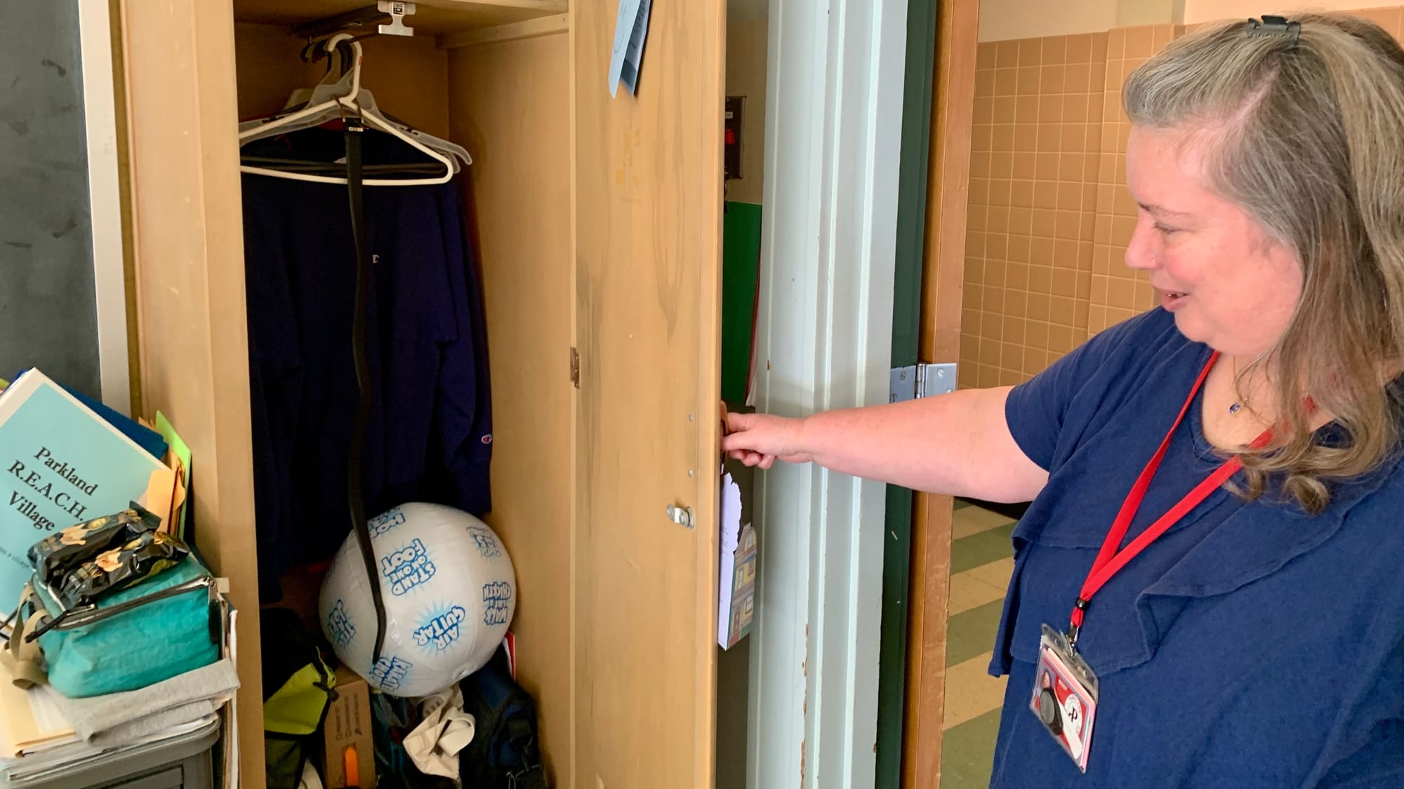 Parkland School District Social Worker Diane Irish shows the clothing closet in the Parkland REACH Village.