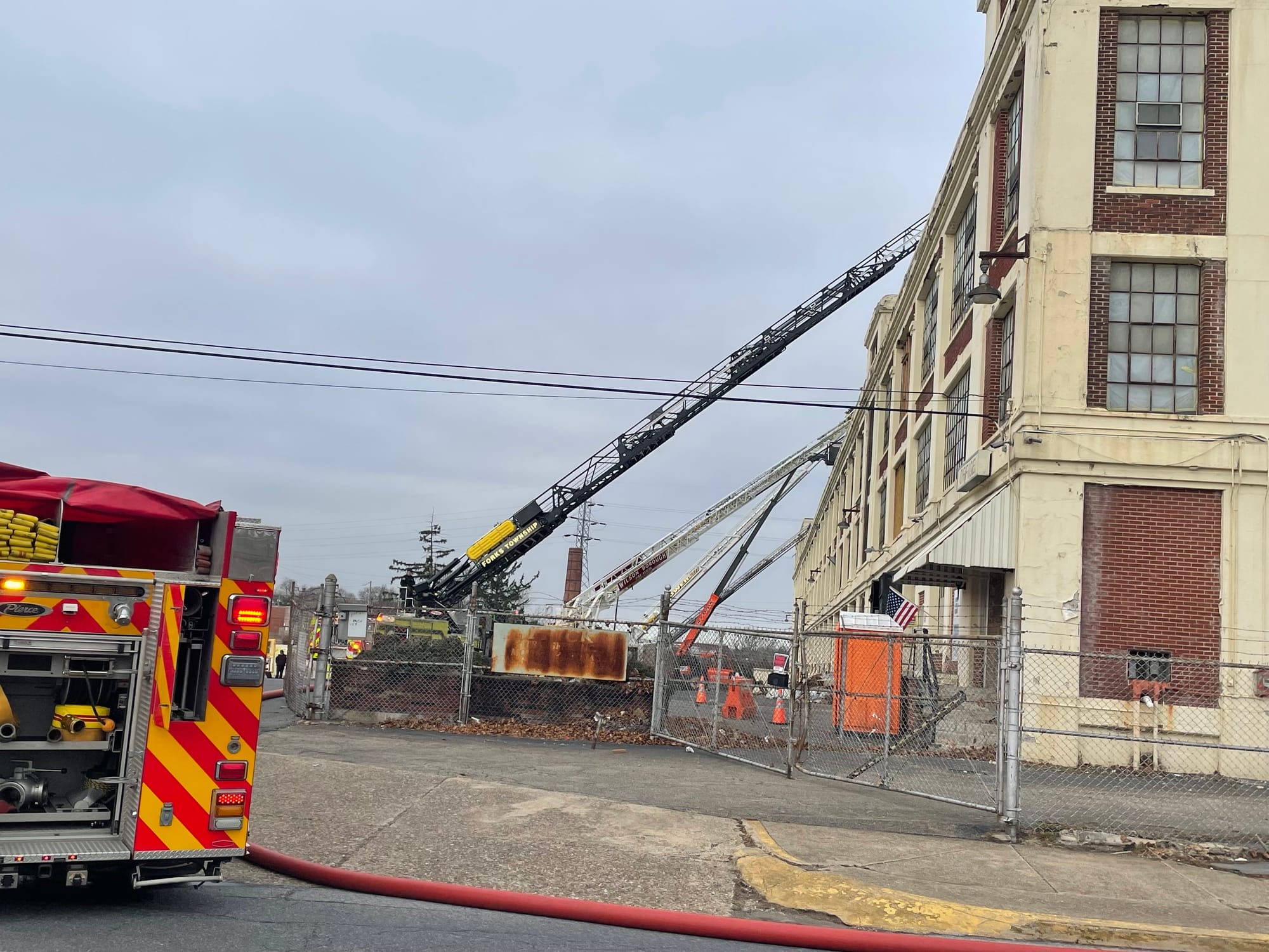 Firefighters respond to the old Dixie Cup building Friday morning after flames broke out in the structure. The fire was dispa