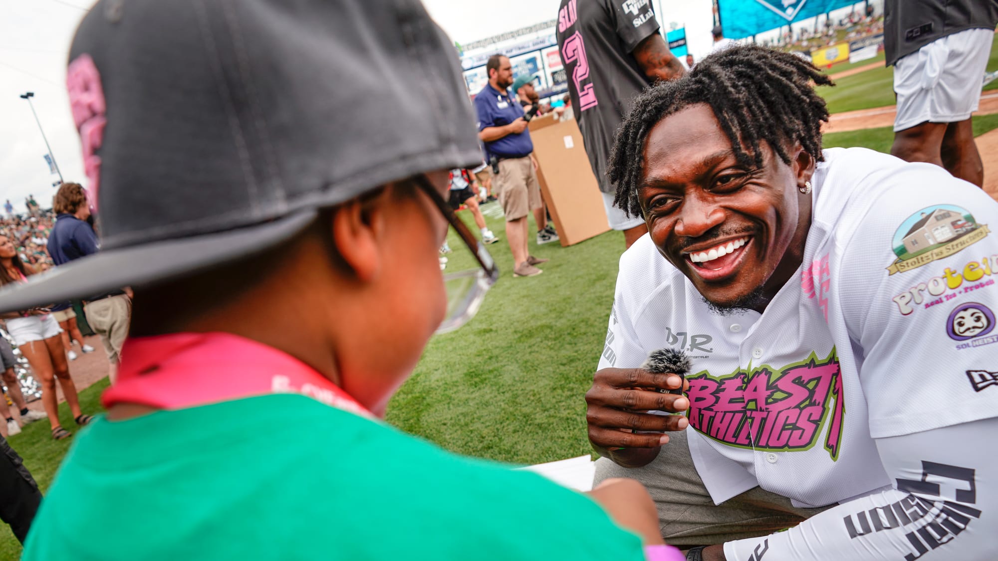 A.J. Brown greets a young fan. The annual DeVonta Smith Celebrity Softball Game featuring Philadelphia Eagles and other athle