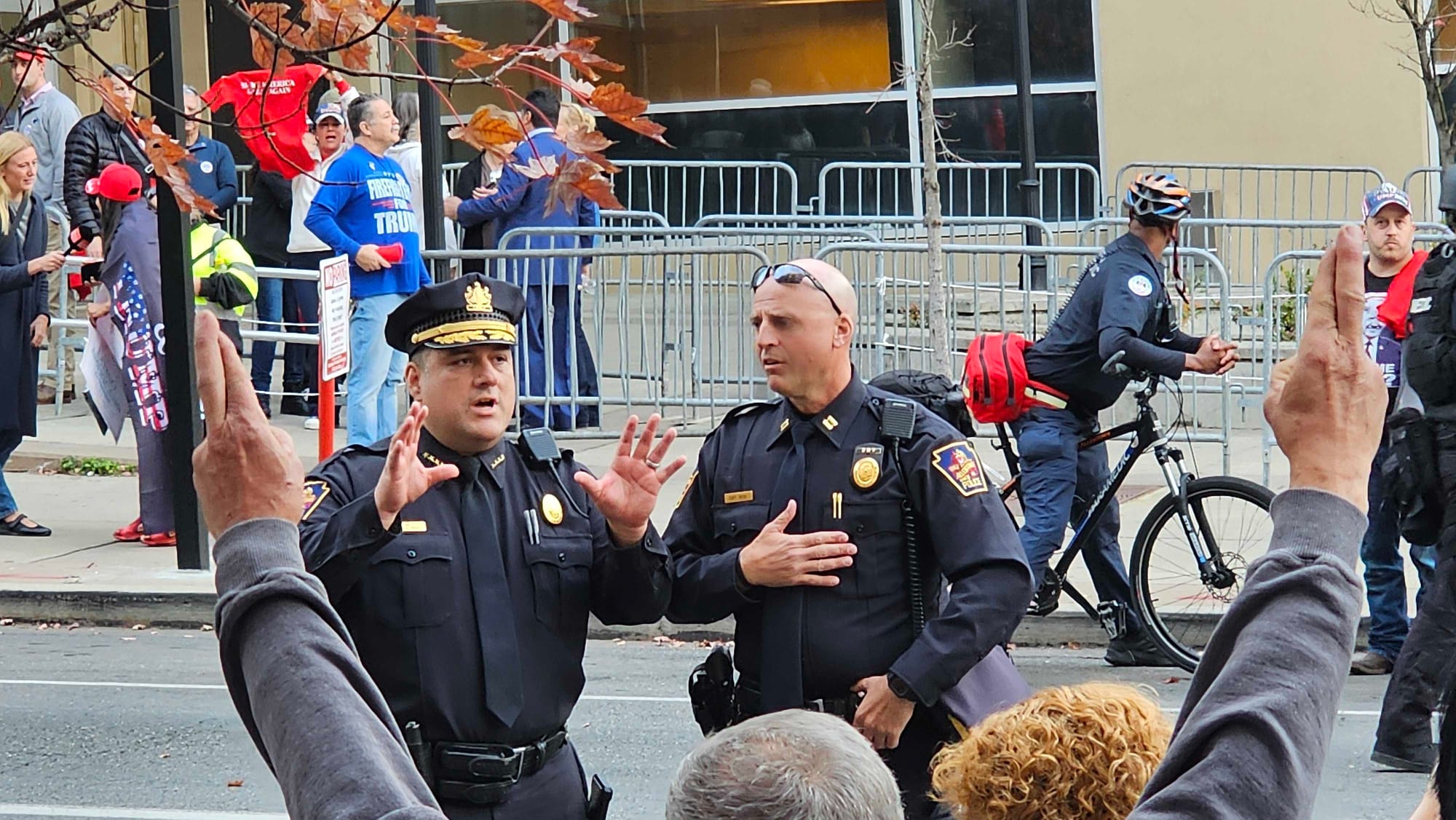 Allentown Police Chief Charles Roca and officers urge protesters to stay on the 7th Street block.