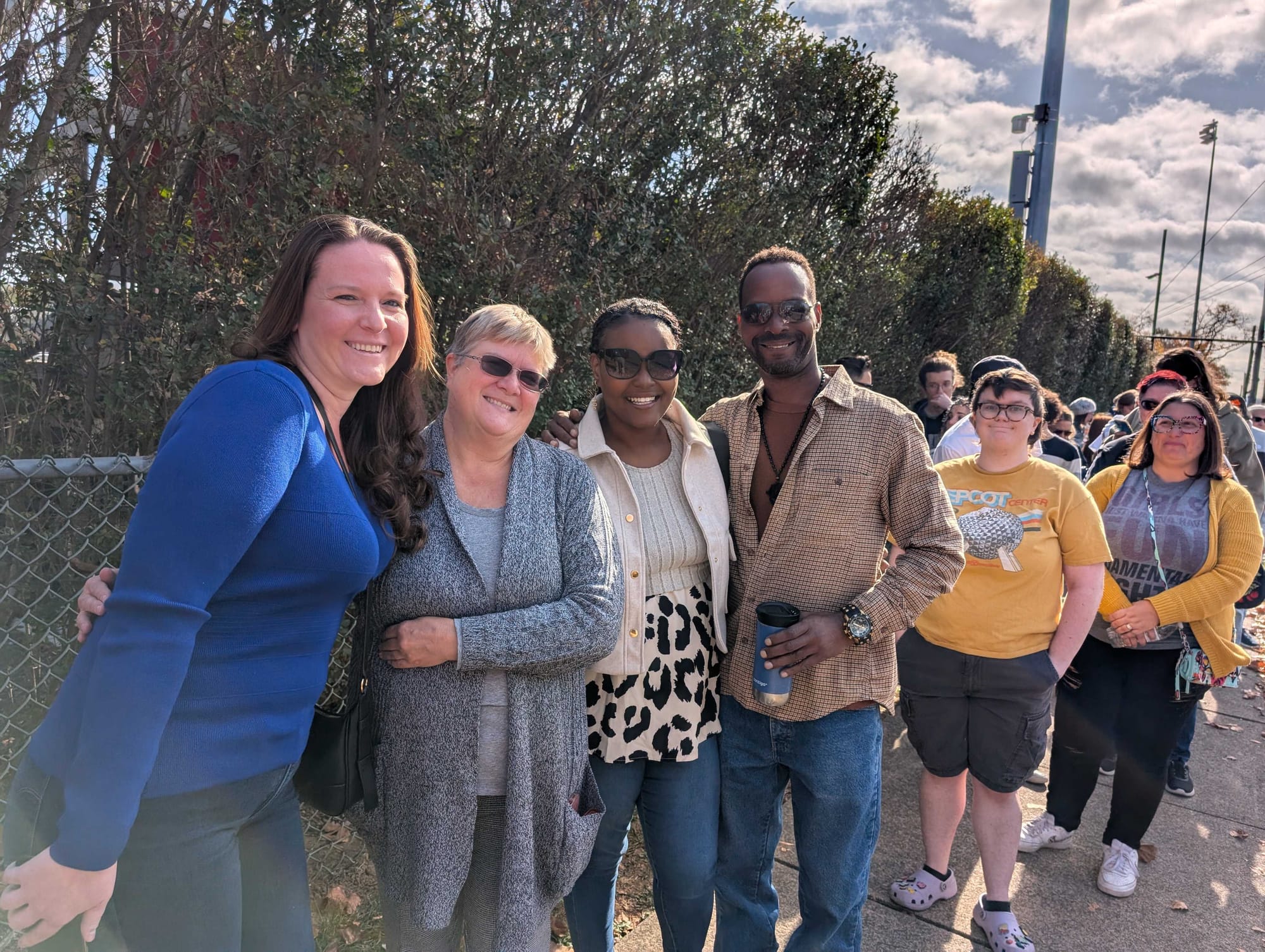 Kamala Harris supporters Christina Meyer, Deb Zelenack, Qia Walters, and James Jones in line Monday at Muhlenberg College in 