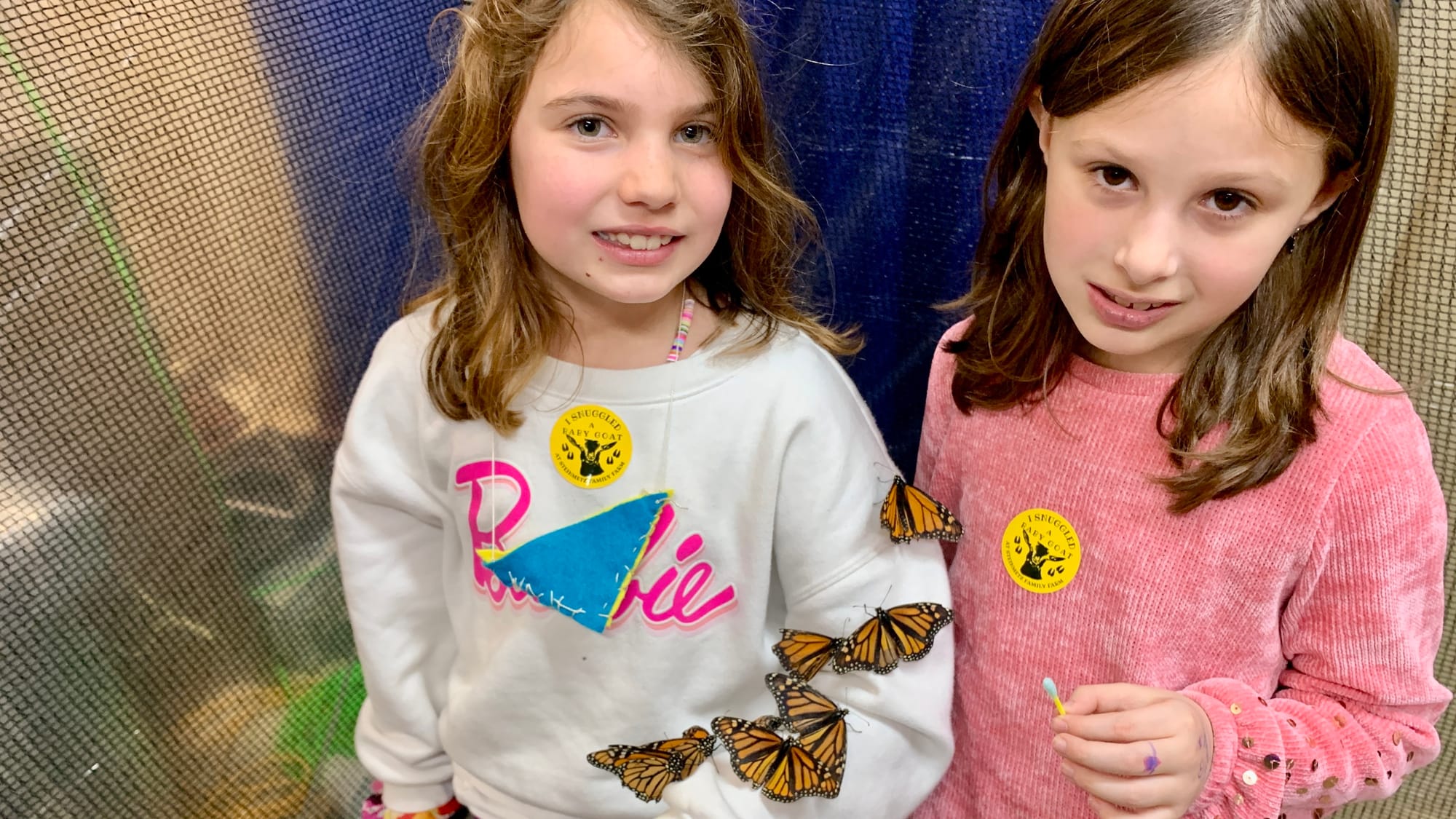 Attendees RyLynn and Leah at the Folk's Butterfly Farm display.